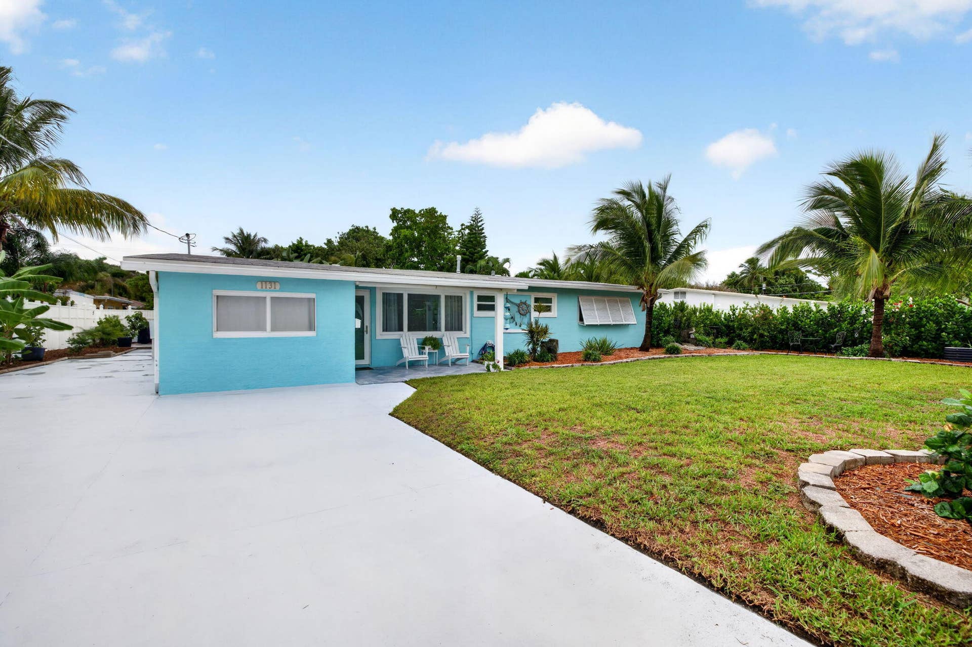 Large front yard with privacy hedge