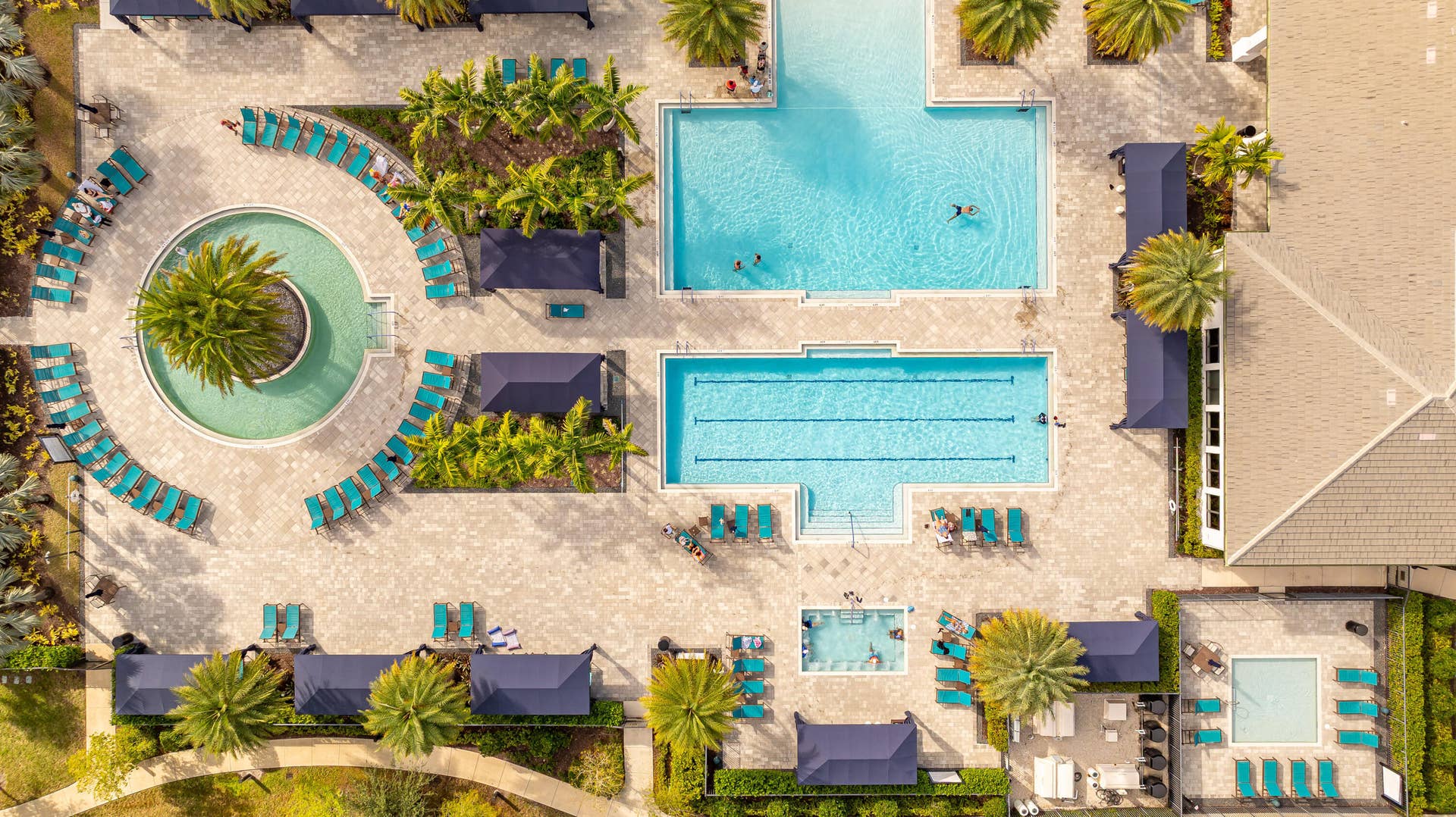 12953 VENETO SPRINGS Drive, Boynton Beach, FL 33473 Aerial View Of 5 Heated Pools (Hot Tub, Resistance pool, Lap Pool, Kiddie pool, Walk-In all purpose Swim)