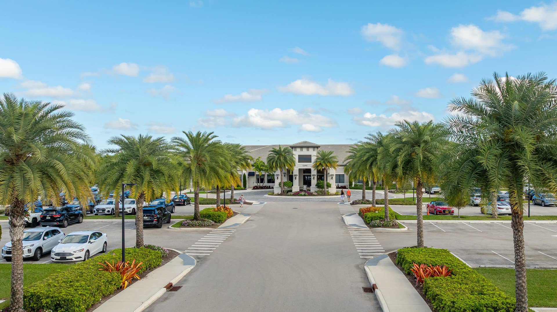 12953 VENETO SPRINGS Drive, Boynton Beach, FL 33473 View Of Clubhouse And parking With Covered Entry For Resident Drop-Off