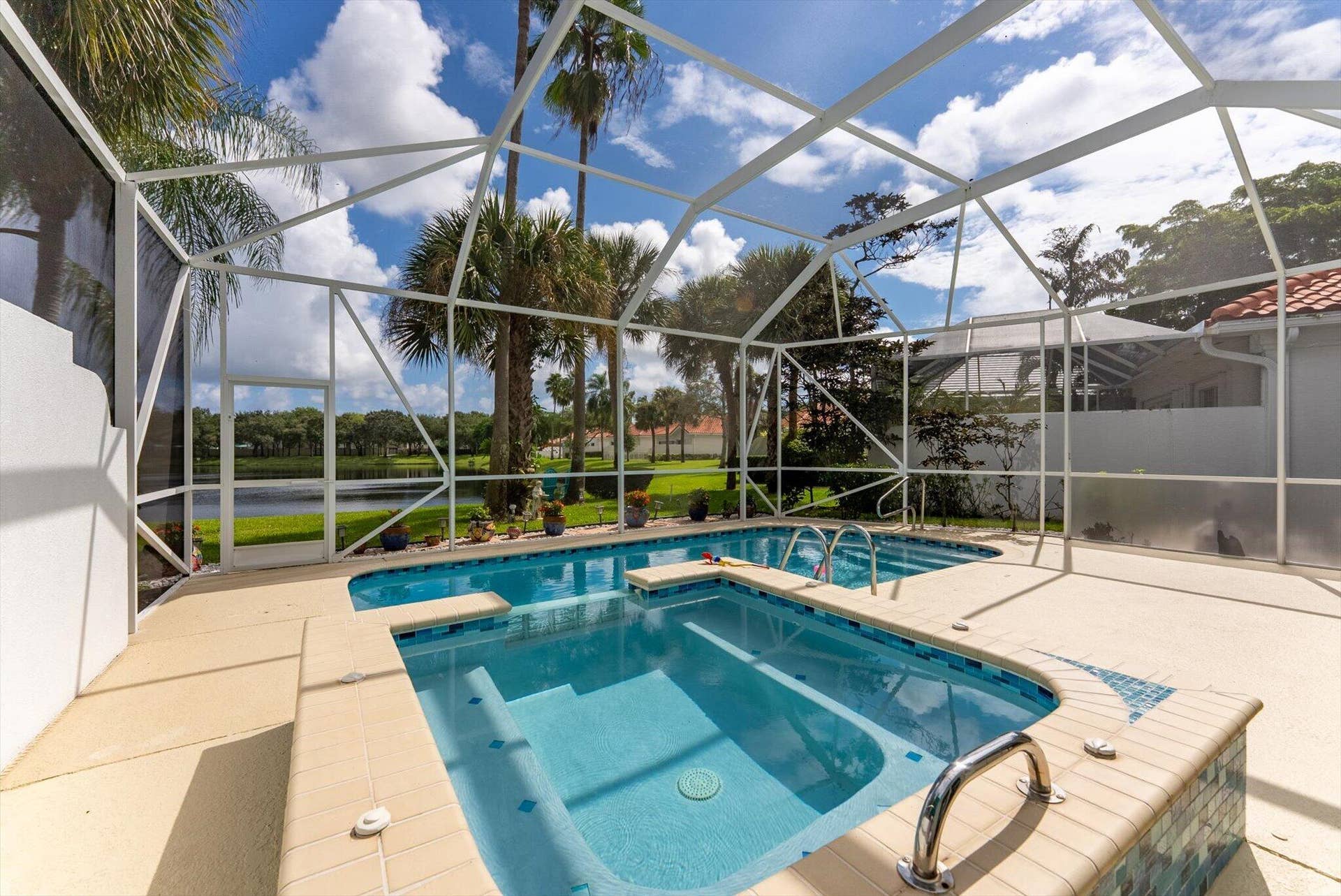 2067 Valencia Drive, Delray Beach, FL 33445 Pool + Spa with Lake Views