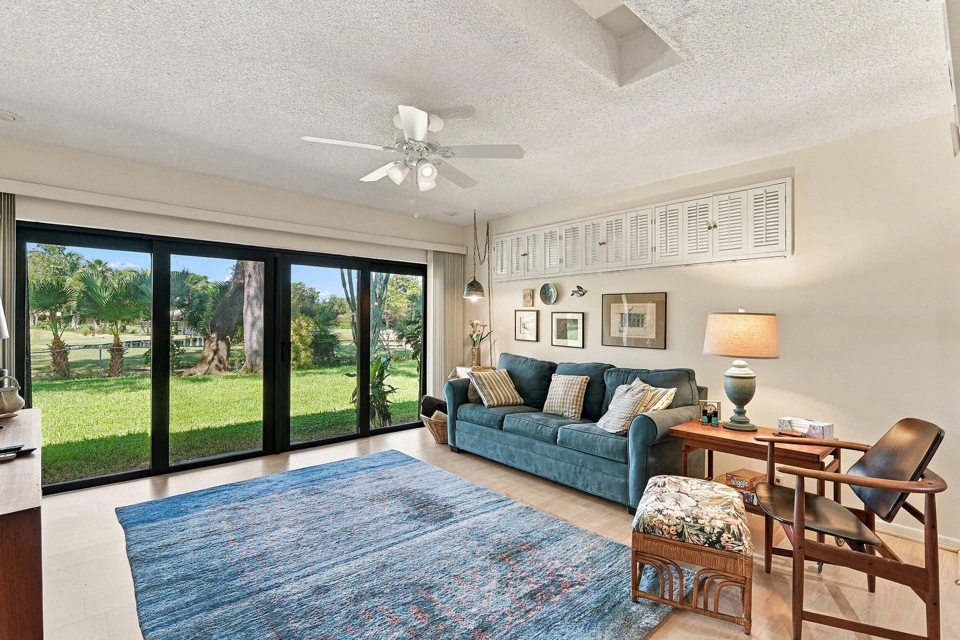1101 SAINT ANDREWS Road, #4, Hollywood, FL 33021 Living area - impact sliders with view to golf course and lagoon