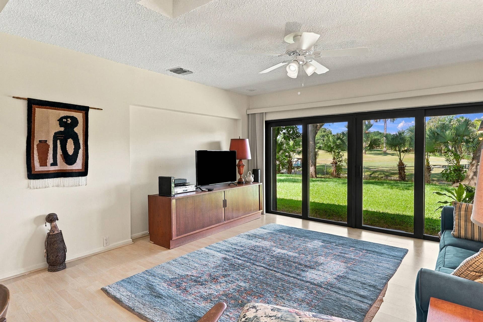 1101 SAINT ANDREWS Road, #4, Hollywood, FL 33021 Living area - impact sliders with view to golf course and lagoon