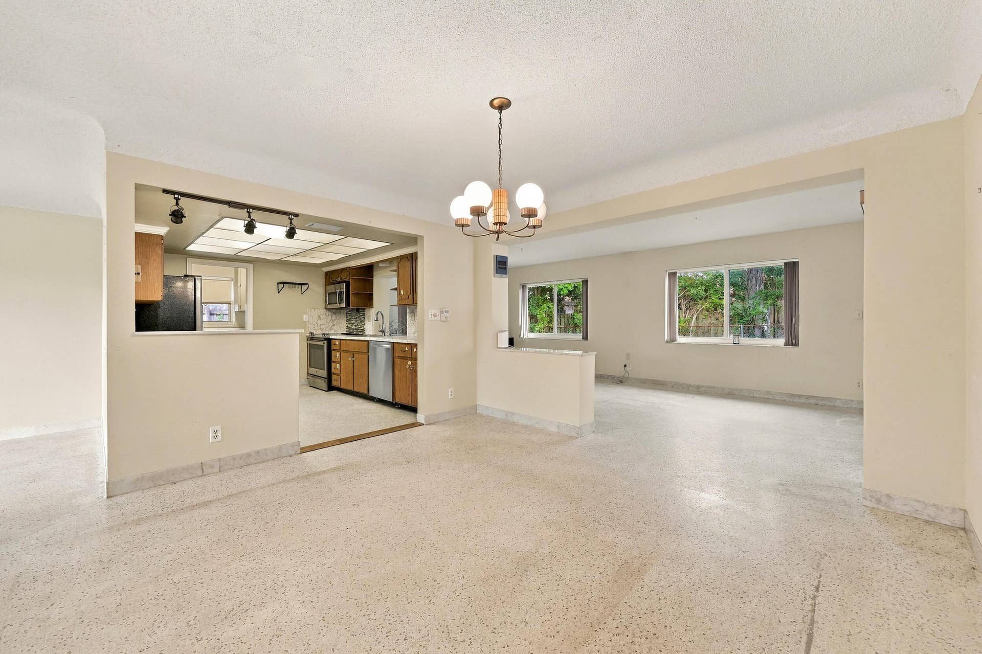 213 NE 24th Court, Boca Raton, FL 33431 The versatile floor plan offers a living room, family room, and sunroom.