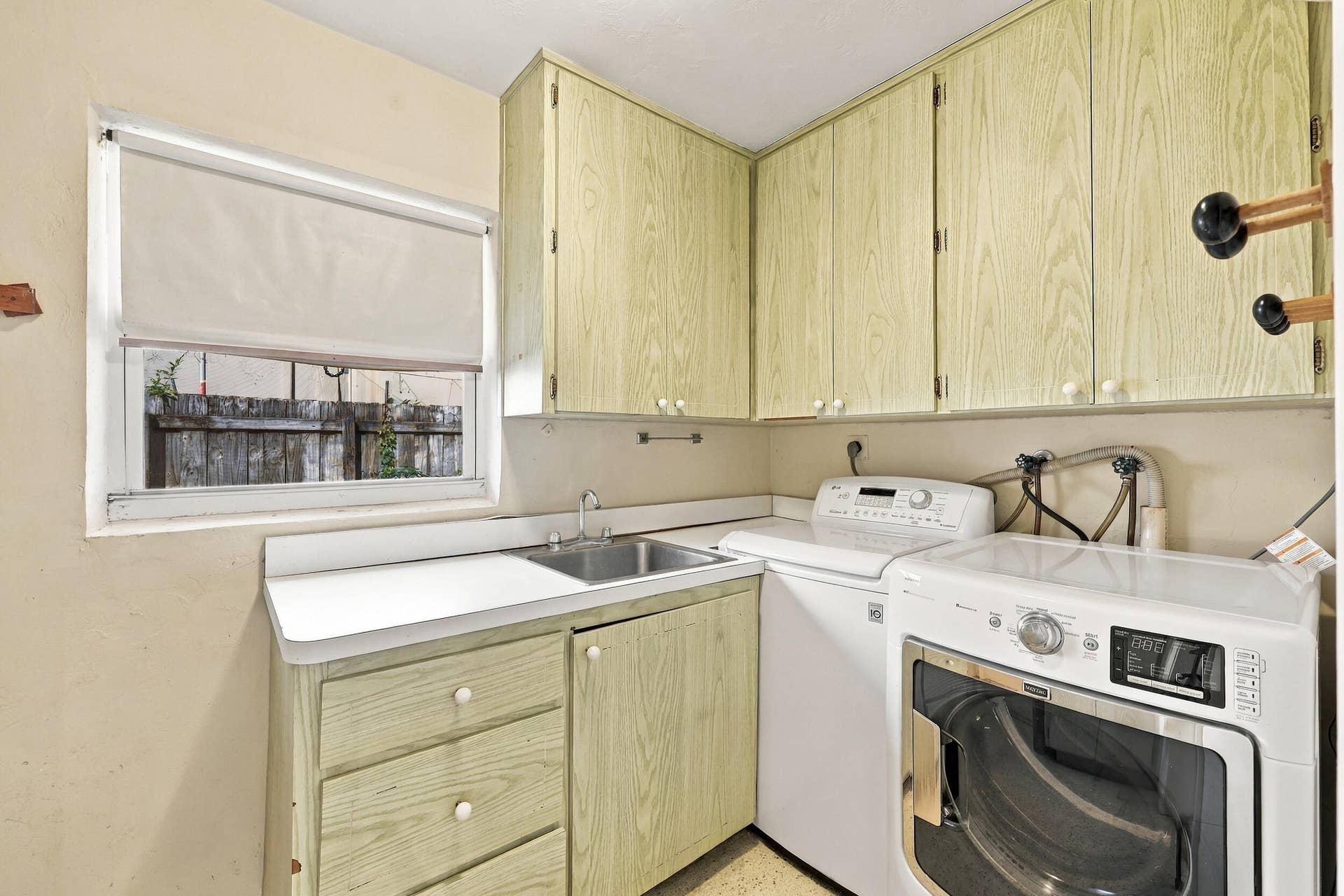 213 NE 24th Court, Boca Raton, FL 33431 A full-size laundry room also acts as a mud room as you go from the one-car garage into the home.