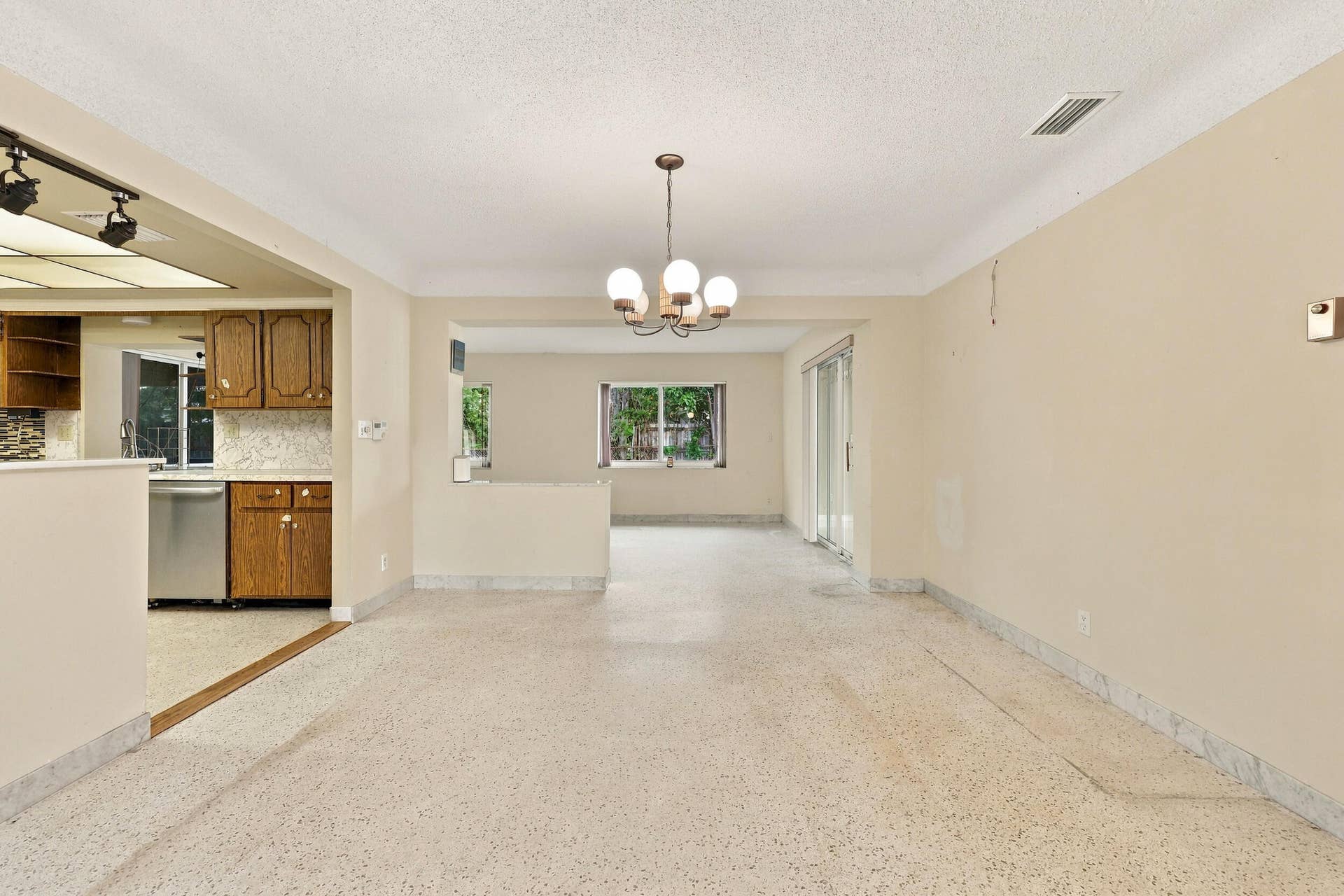 213 NE 24th Court, Boca Raton, FL 33431 The versatile floor plan offers a living room, family room, and sunroom.