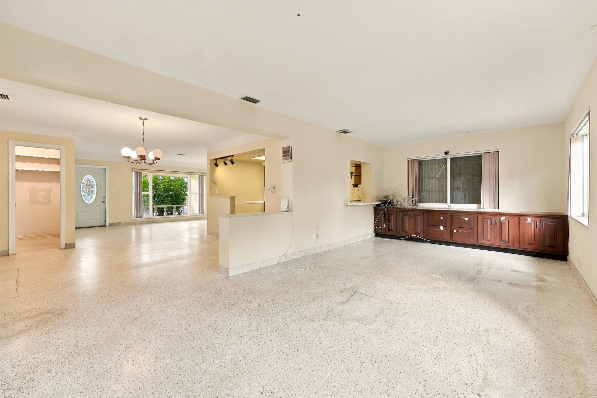 213 NE 24th Court, Boca Raton, FL 33431 The versatile floor plan offers a living room, family room, and sunroom.