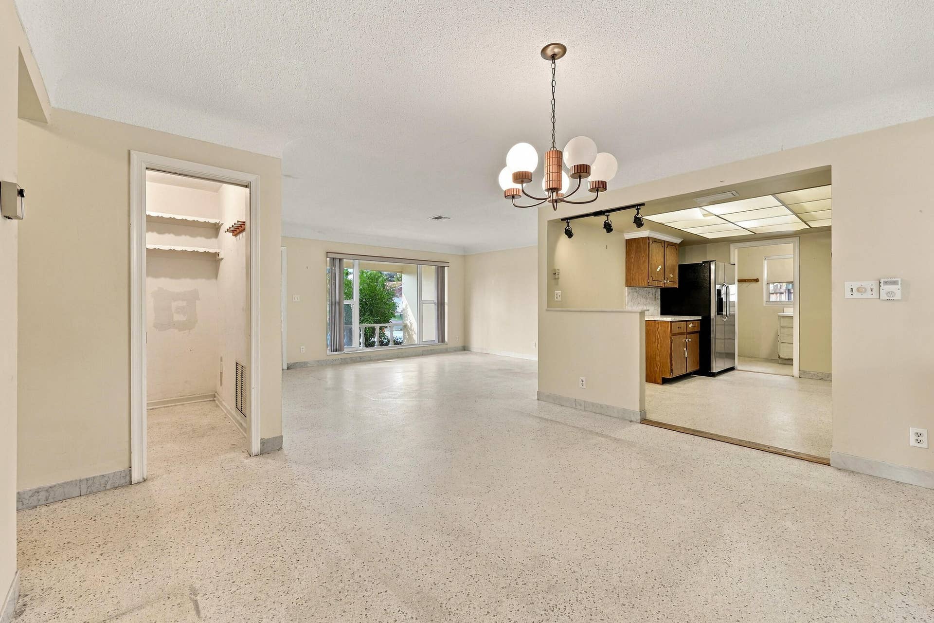 213 NE 24th Court, Boca Raton, FL 33431 The versatile floor plan offers a living room, family room, and sunroom.