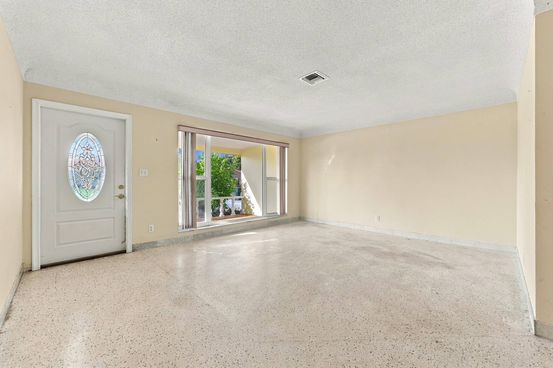 213 NE 24th Court, Boca Raton, FL 33431 The versatile floor plan offers a living room, family room, and sunroom.