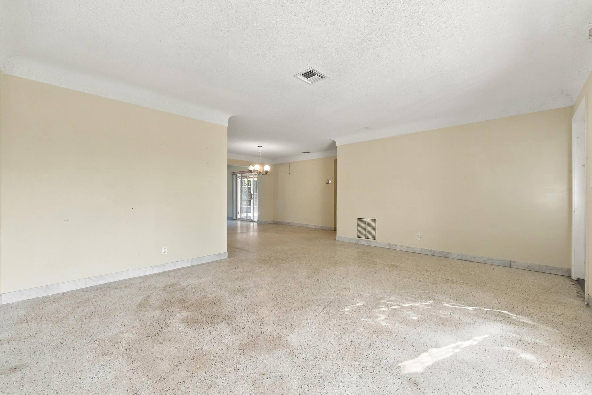 213 NE 24th Court, Boca Raton, FL 33431 The versatile floor plan offers a living room, family room, and sunroom.