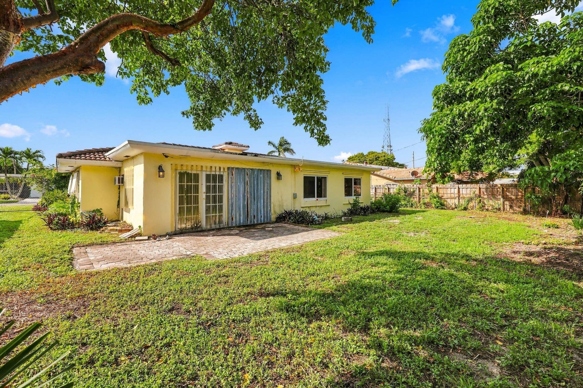 213 NE 24th Court, Boca Raton, FL 33431 The oversized, fully fenced-in backyard offers plenty of room for a pool or an additional space to store all of your toys!
