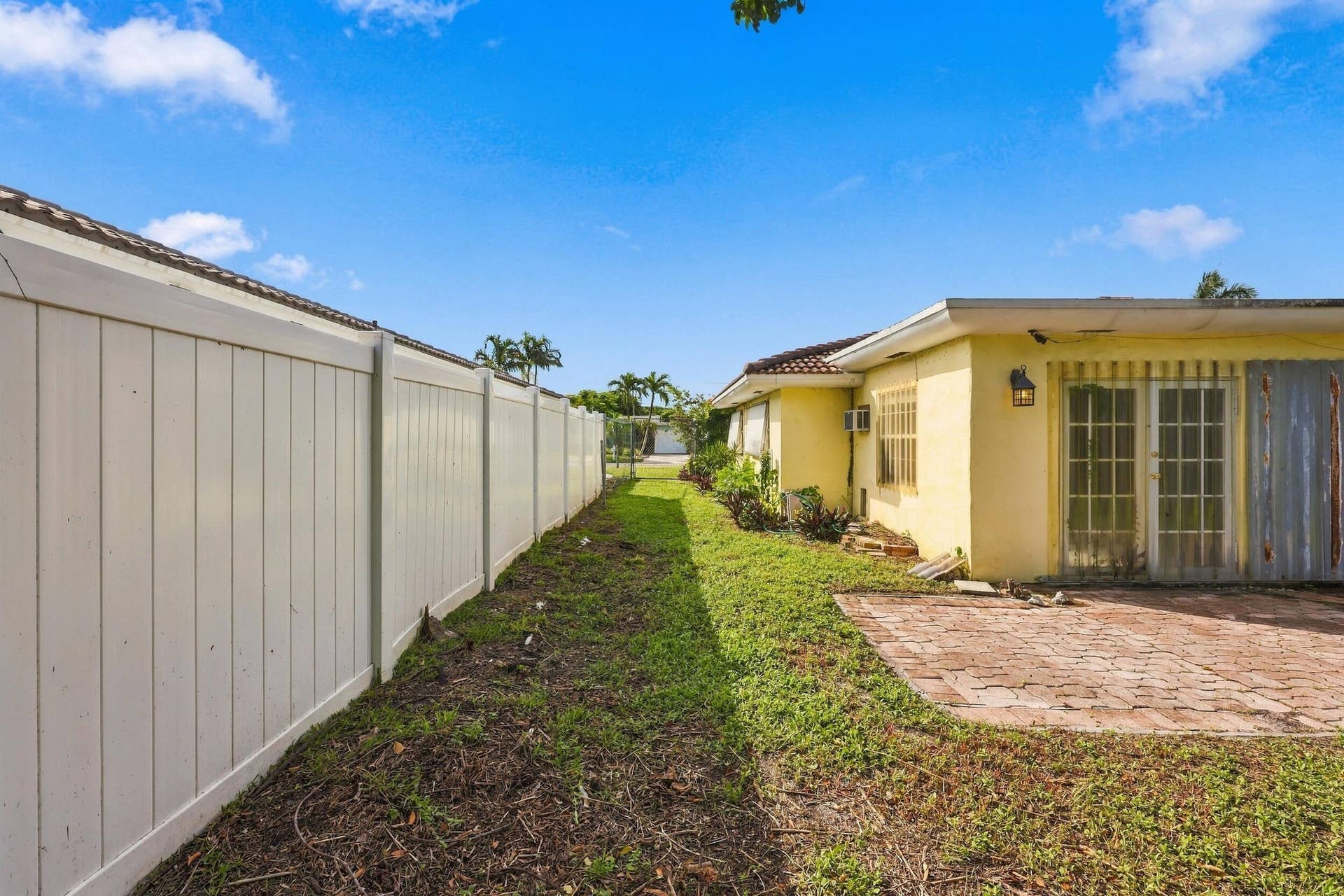 213 NE 24th Court, Boca Raton, FL 33431 The oversized, fully fenced-in backyard offers plenty of room for a pool or an additional space to store all of your toys!