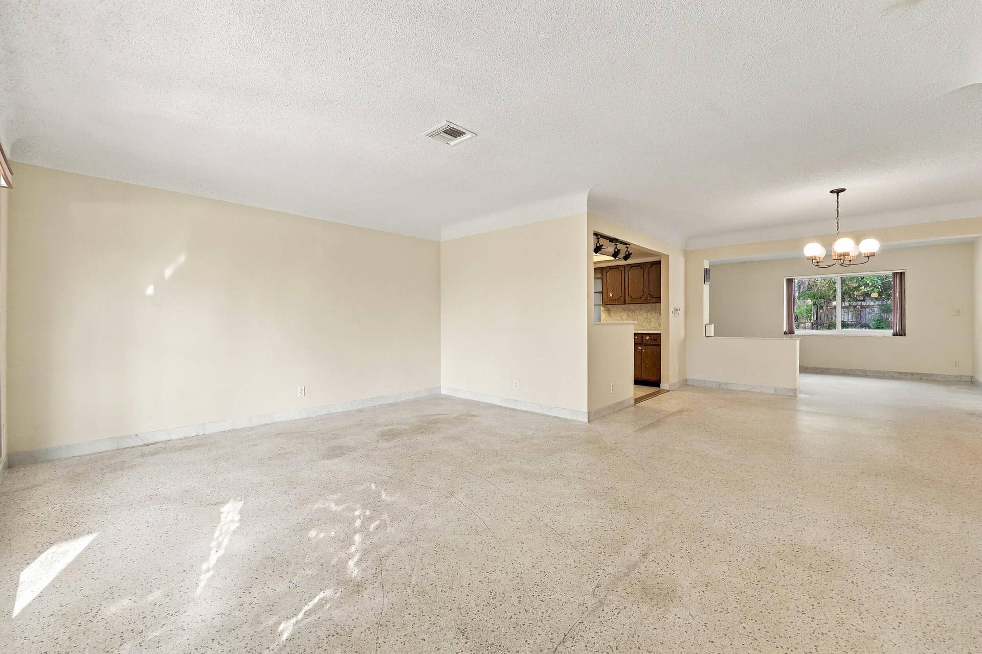 213 NE 24th Court, Boca Raton, FL 33431 The versatile floor plan offers a living room, family room, and sunroom.