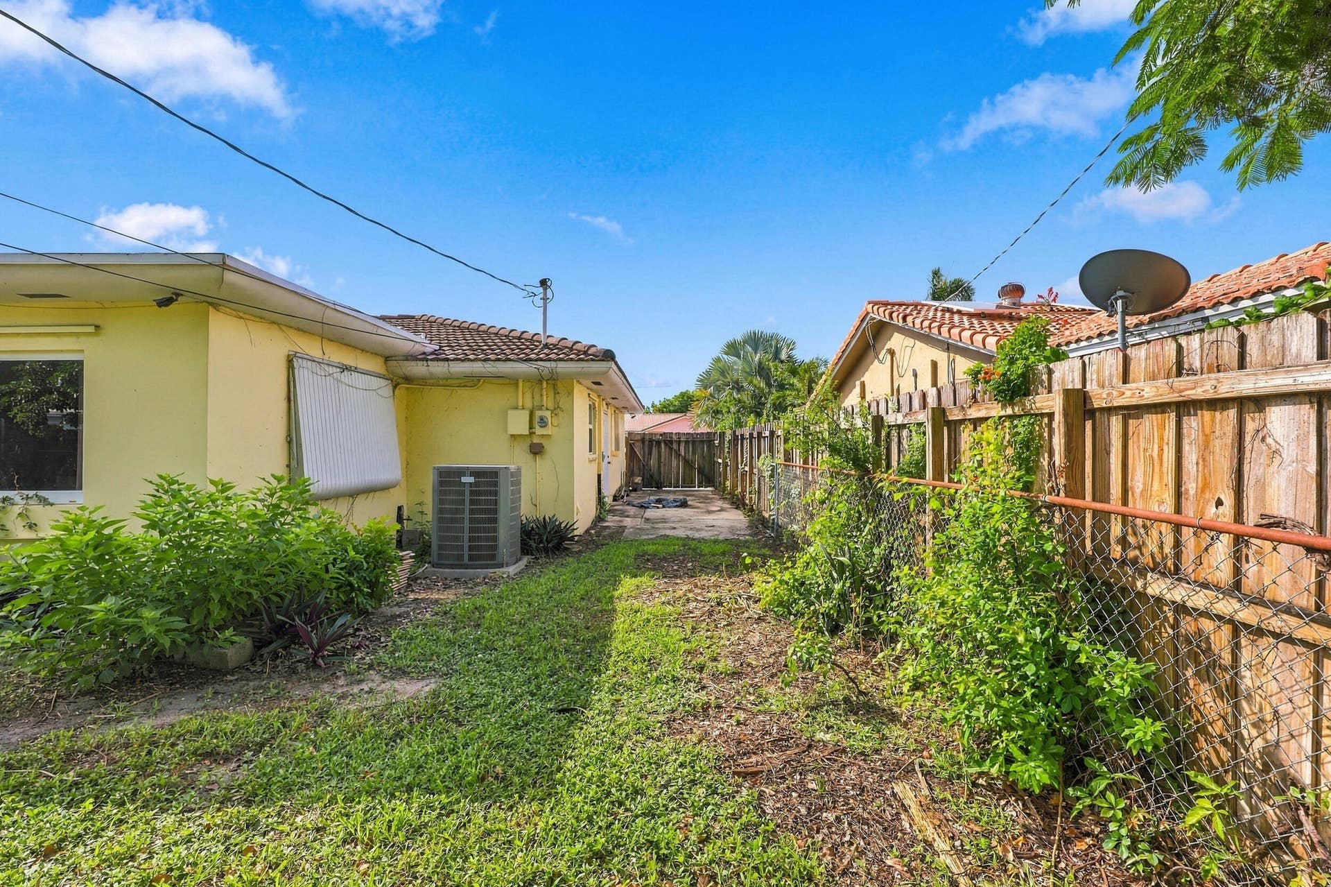 213 NE 24th Court, Boca Raton, FL 33431 The oversized, fully fenced-in backyard offers plenty of room for a pool or an additional space to store all of your toys!