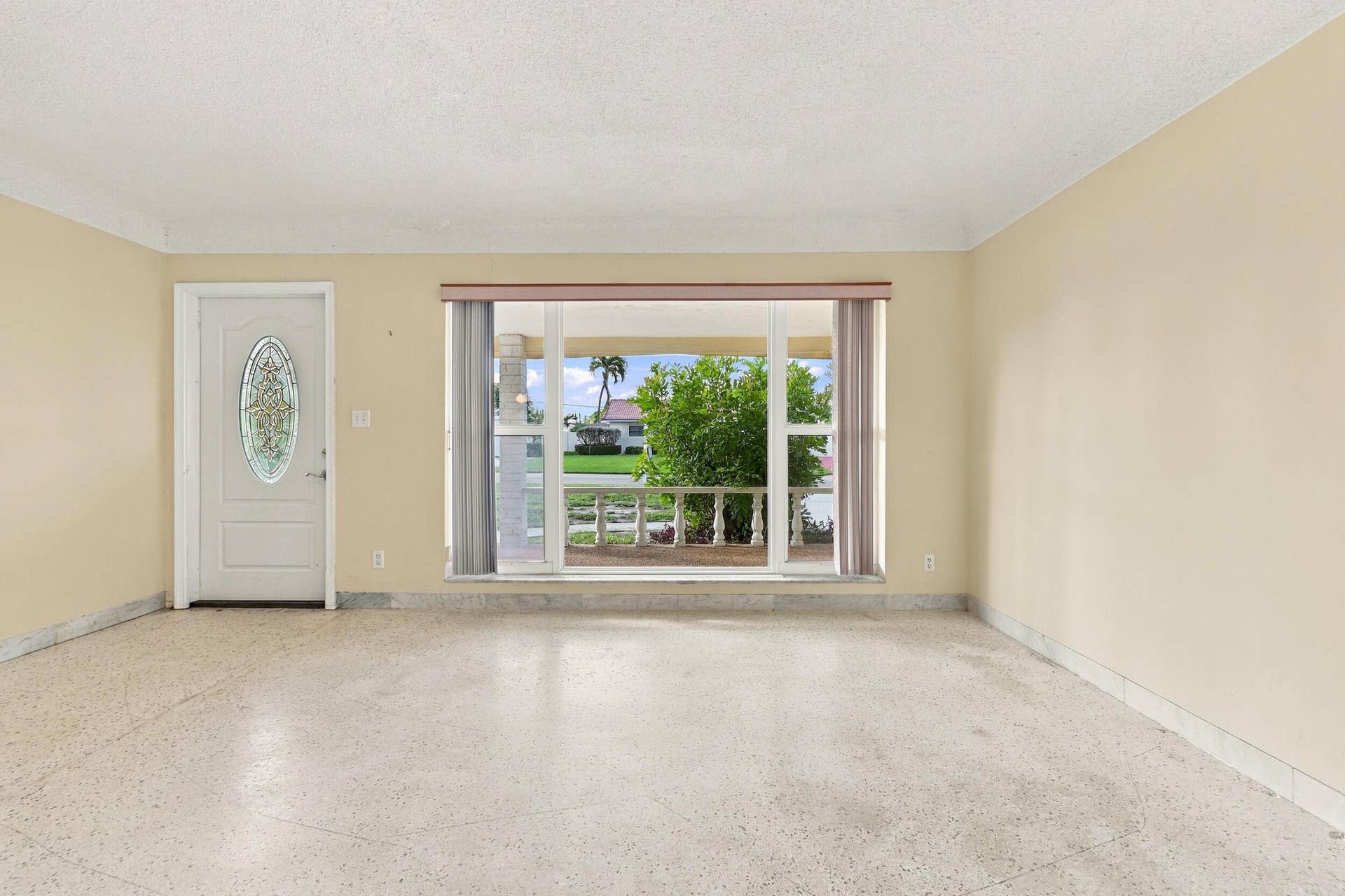 213 NE 24th Court, Boca Raton, FL 33431 As you enter, you are greeted by a large open floor plan and lots of natural light coming through the hurricane impact windows.