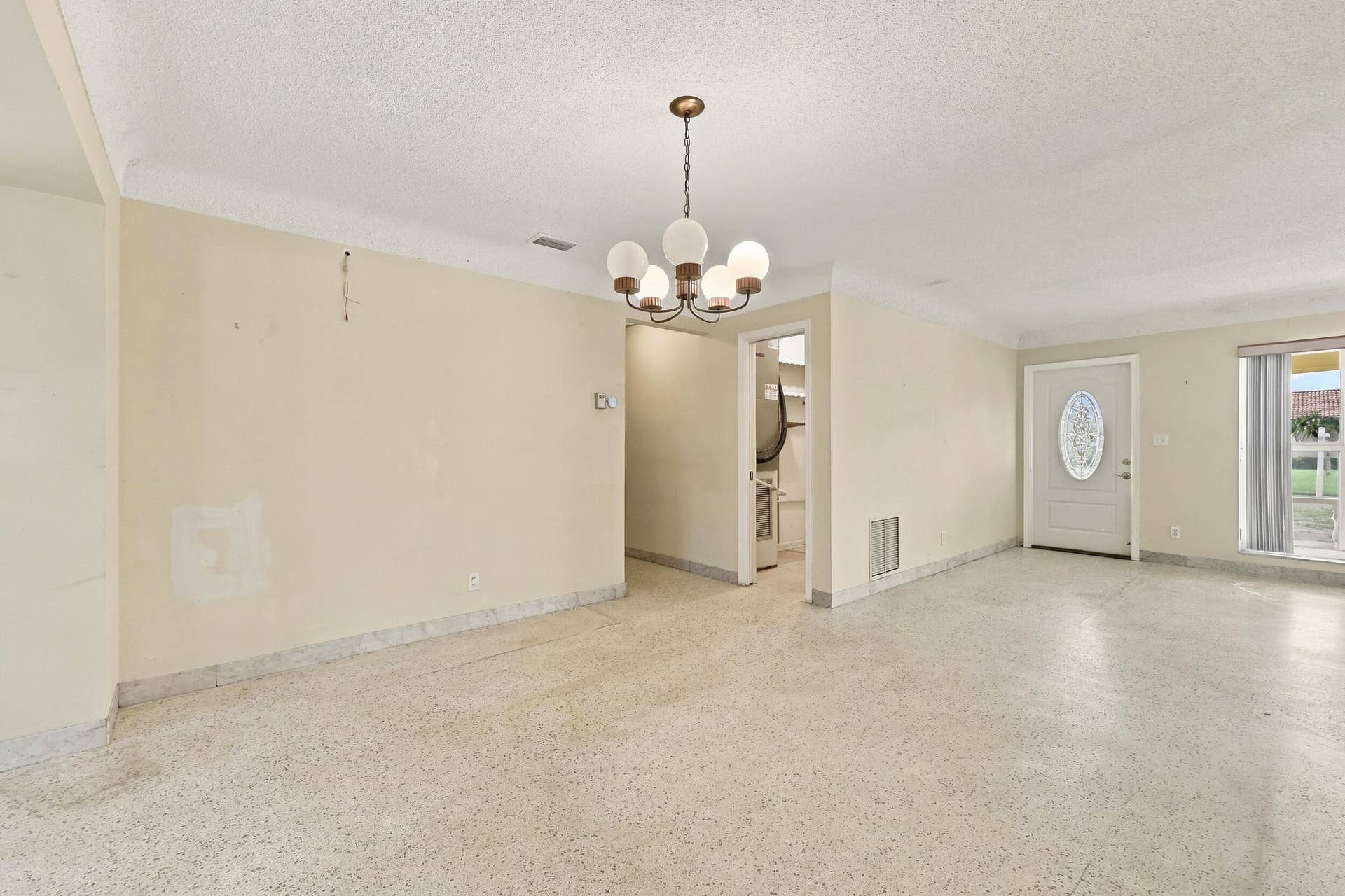 213 NE 24th Court, Boca Raton, FL 33431 As you enter, you are greeted by a large open floor plan and lots of natural light coming through the hurricane impact windows.