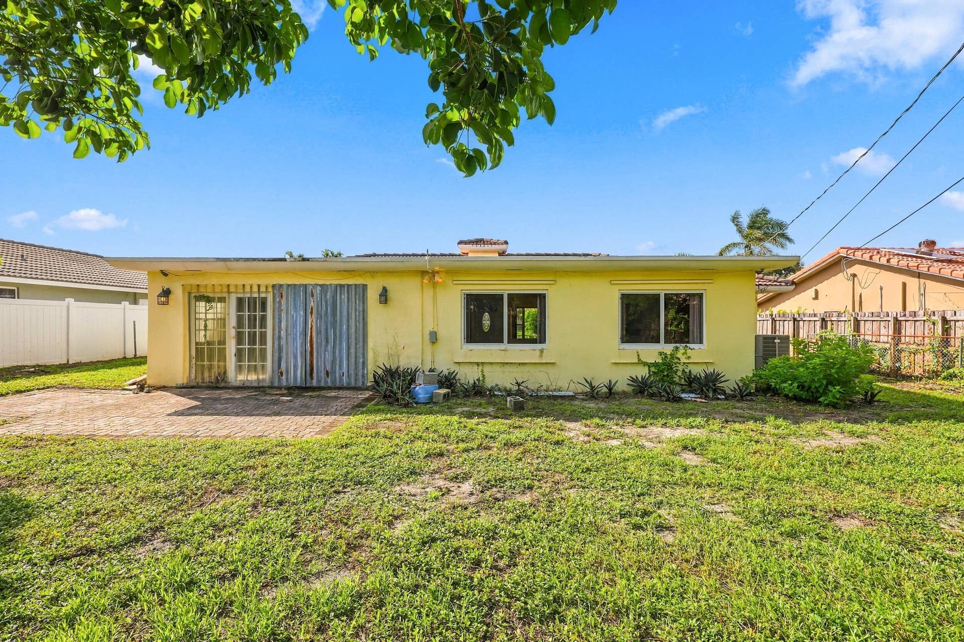 213 NE 24th Court, Boca Raton, FL 33431 The oversized, fully fenced-in backyard offers plenty of room for a pool or an additional space to store all of your toys!