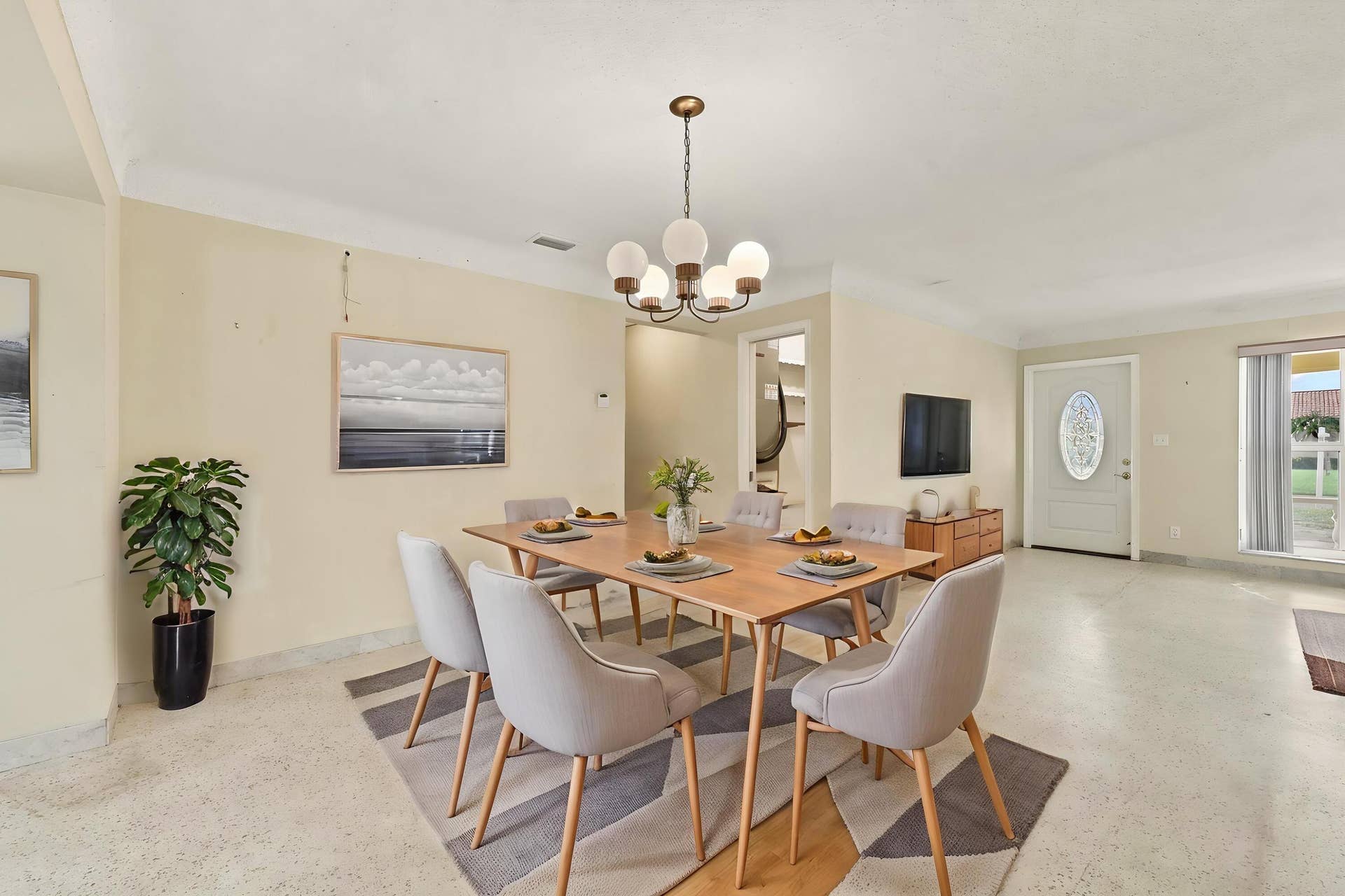 213 NE 24th Court, Boca Raton, FL 33431 As you enter, you are greeted by a large open floor plan and lots of natural light coming through the hurricane impact windows.
