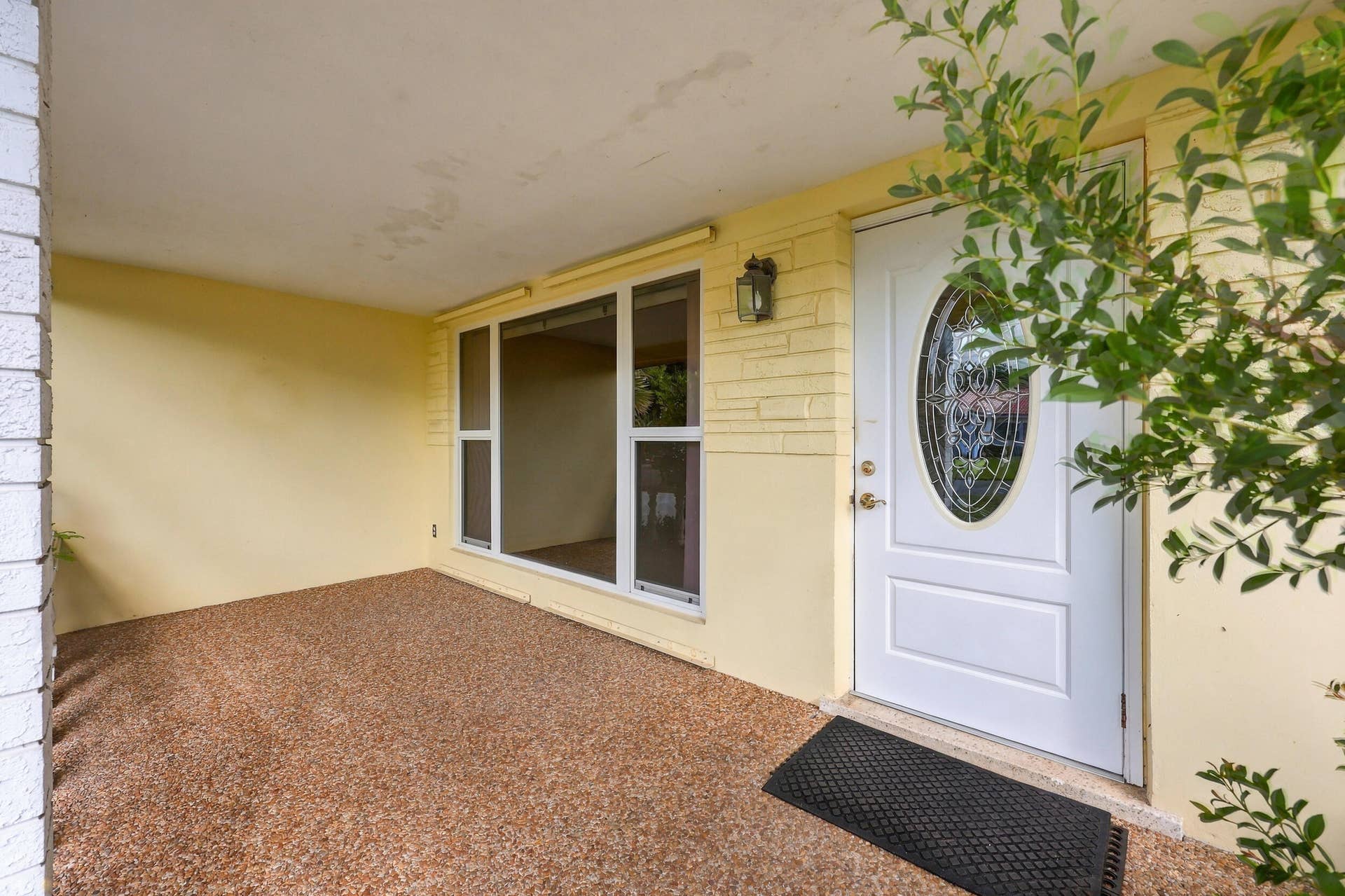 213 NE 24th Court, Boca Raton, FL 33431 The covered front patio is a beautiful place to greet your guests. It features impact windows and a new flat roof.