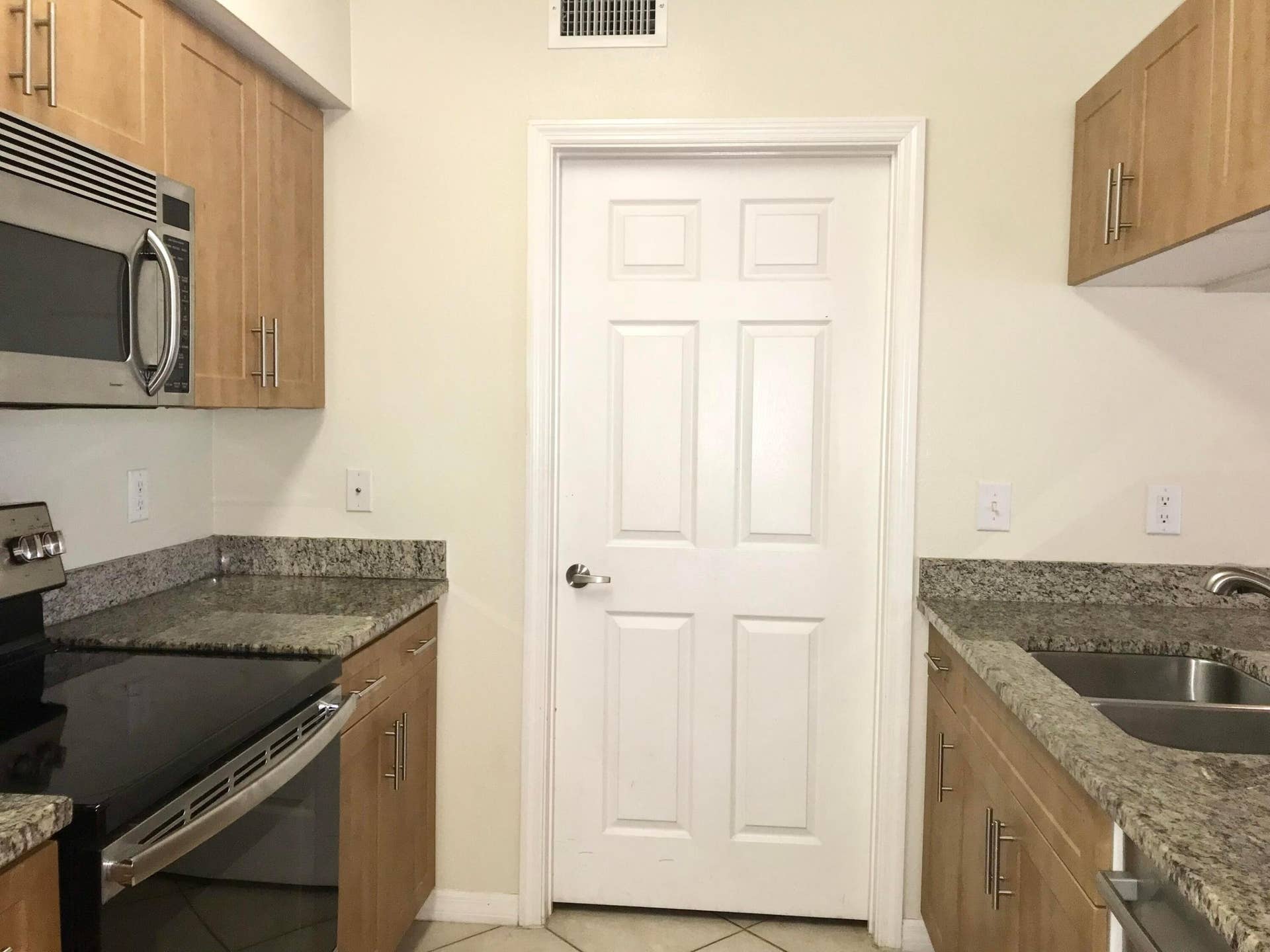 6533 EMERALD DUNES Drive, #107, West Palm Beach, West Palm Beach, FL 33411 entrance to laundry/ storgae room