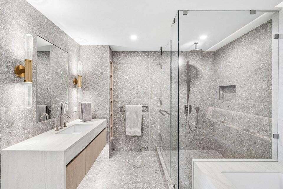 900 N OCEAN Boulevard, #1204, Pompano Beach, FL 33062 Indulge in a spa-inspired primary bathroom featuring an elegant double vanity, sophisticated finishes, and a spacious glass-enclosed shower for the ultimate private retreat.