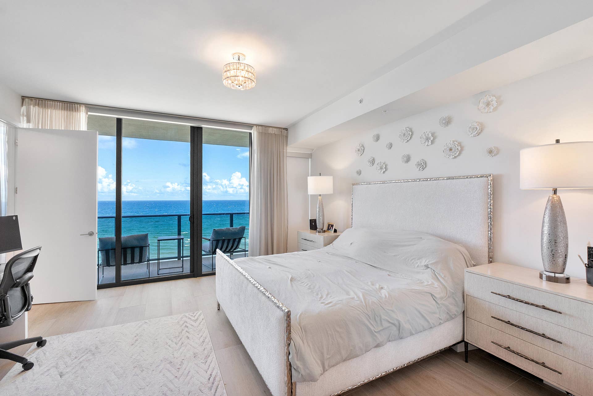 900 N OCEAN Boulevard, #1204, Pompano Beach, FL 33062 Wake up to breathtaking Atlantic Ocean views in this luxurious primary suite, offering floor-to-ceiling glass, generous proportions, and a serene coastal ambiance.