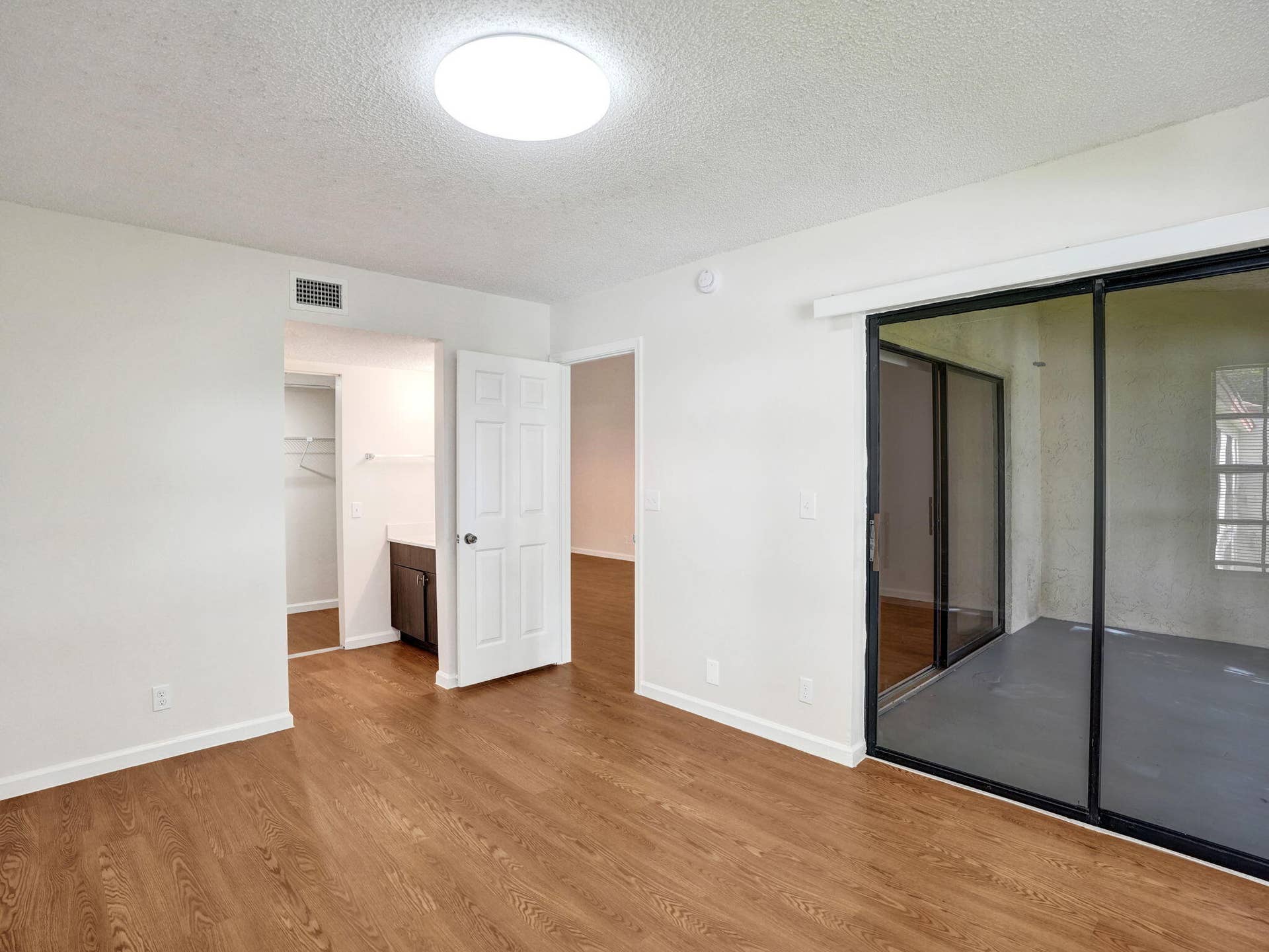 300 Palmwood Place, #P206, Boca Raton, FL 33431 screened balcony access from primary bedroom and living room