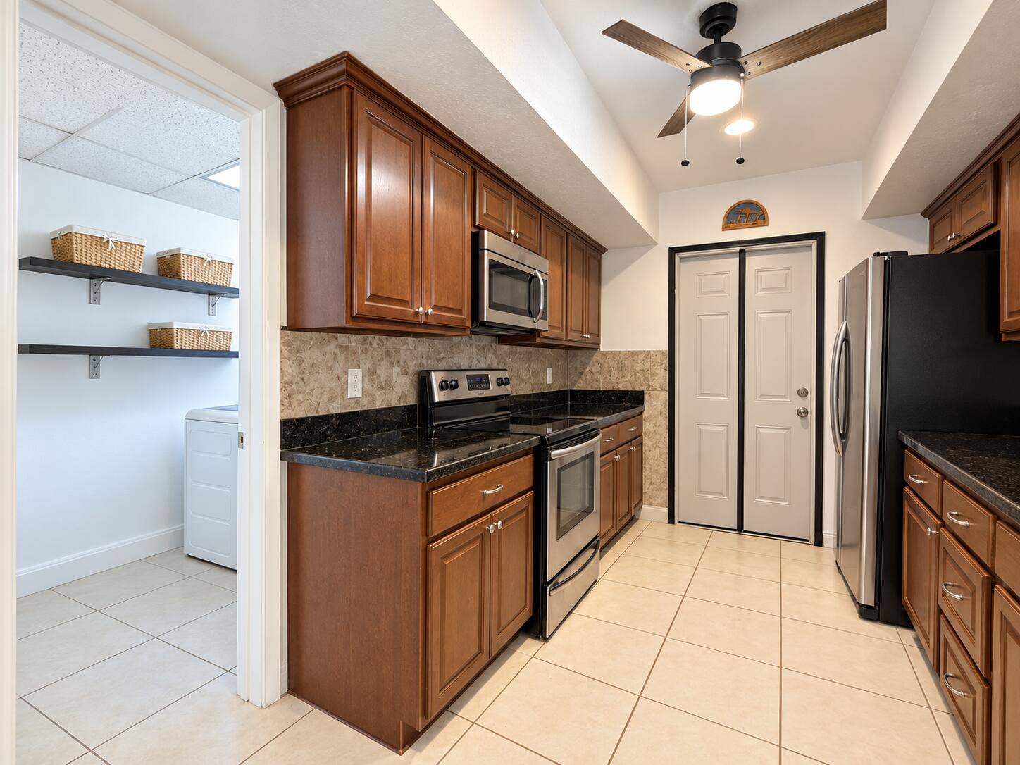 236 TAM O SHANTER Drive, Palm Springs, FL 33461 KitchenLaundry