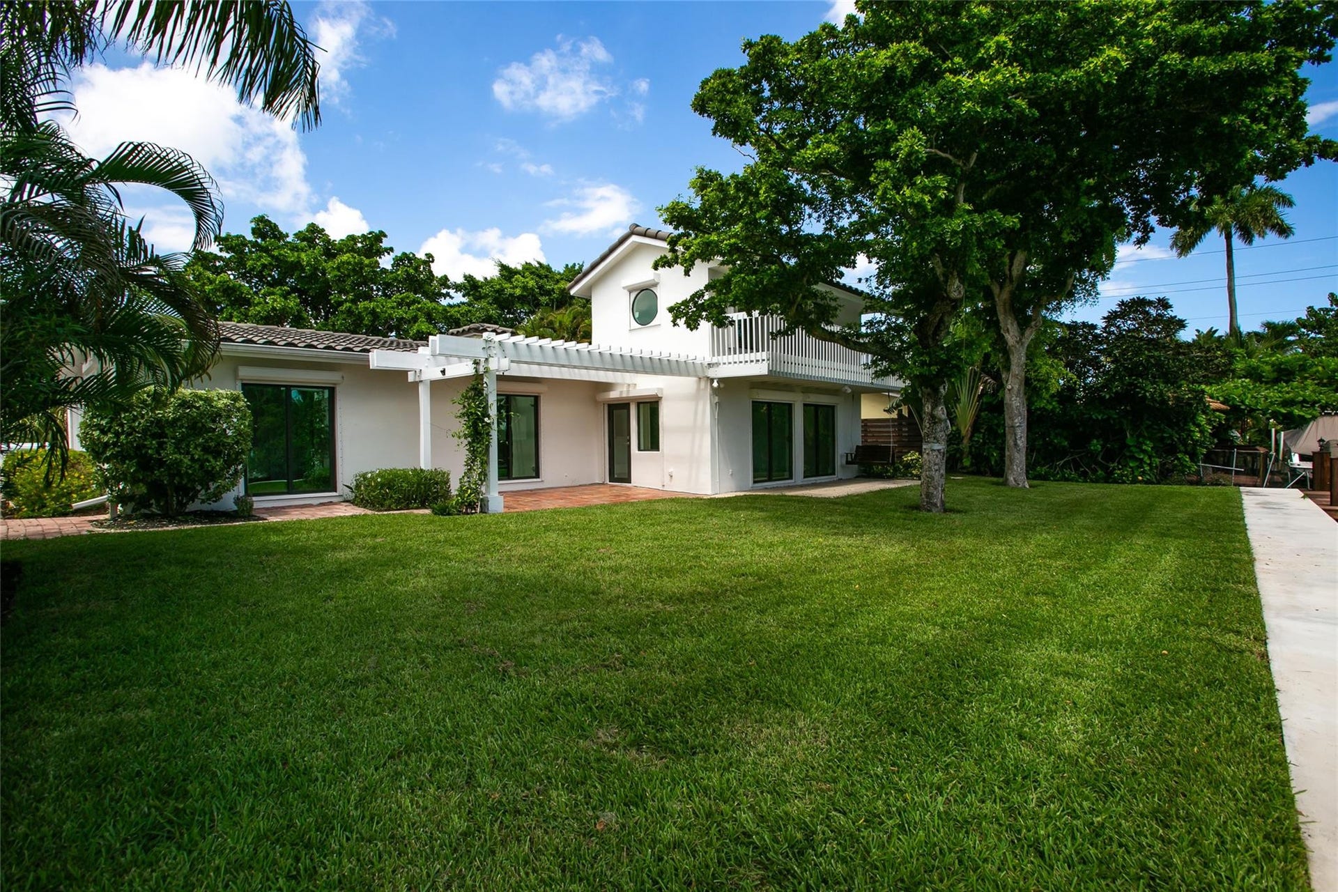1806 NE 22ND Terrace, Fort Lauderdale, Fort Lauderdale, FL 33305 Rear of house with Double patio and expansive lawn