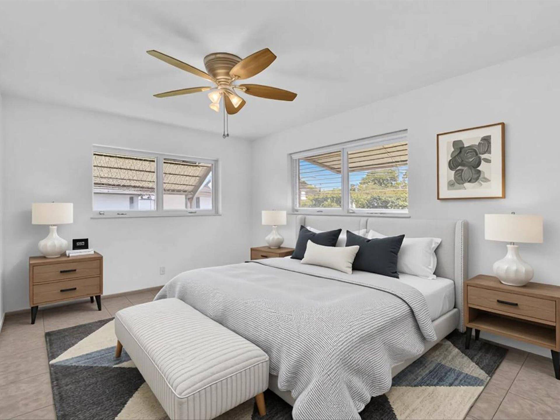 132 SE 2ND Court, Dania Beach, Dania Beach, FL 33004 Neutral interior featuring large windows with sliding panels, tile flooring, and a central ceiling fan with integrated lighting