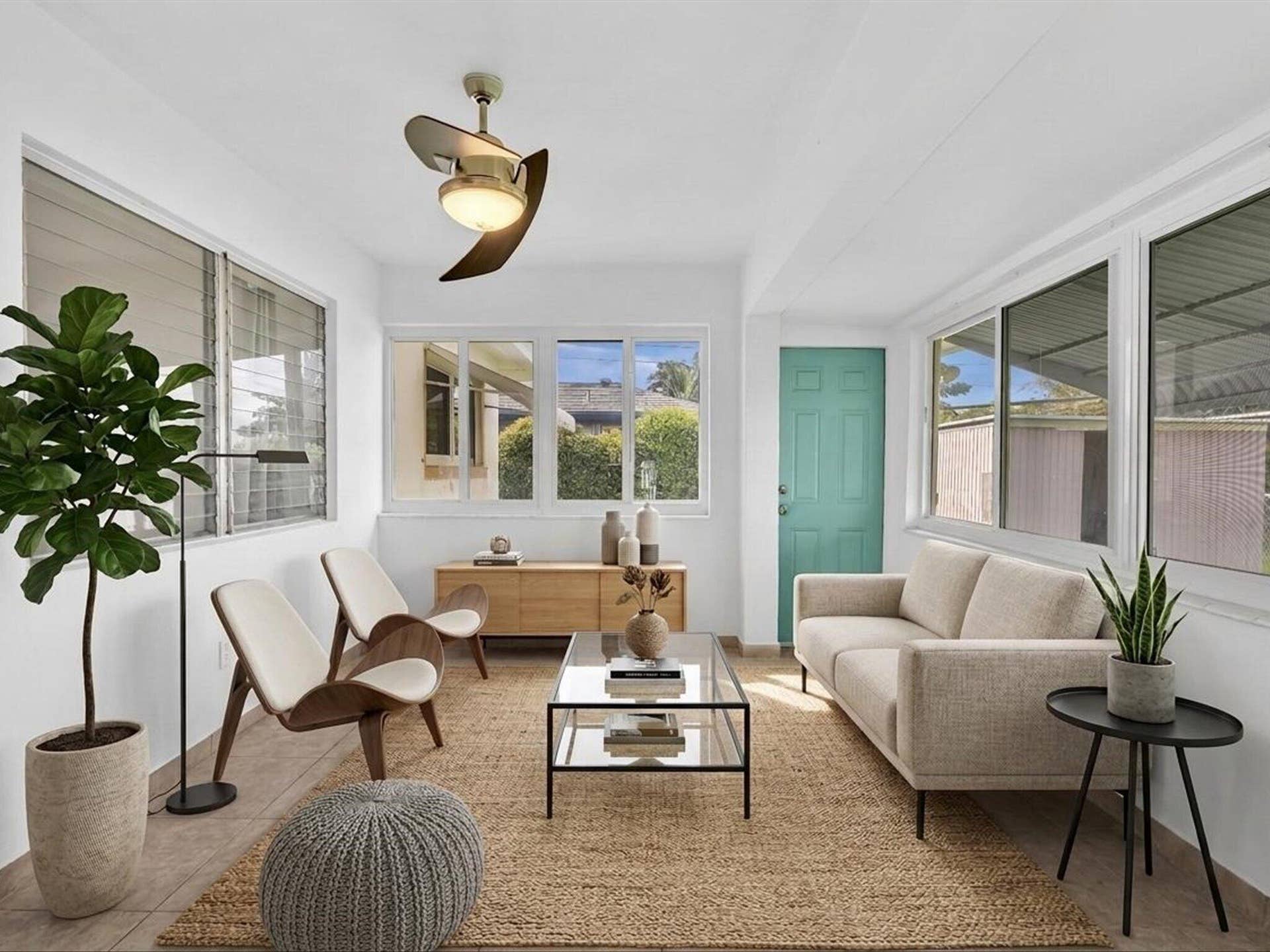 132 SE 2ND Court, Dania Beach, Dania Beach, FL 33004 Sunroom featuring expansive windows, tile flooring, and a modern ceiling fan with integrated lighting