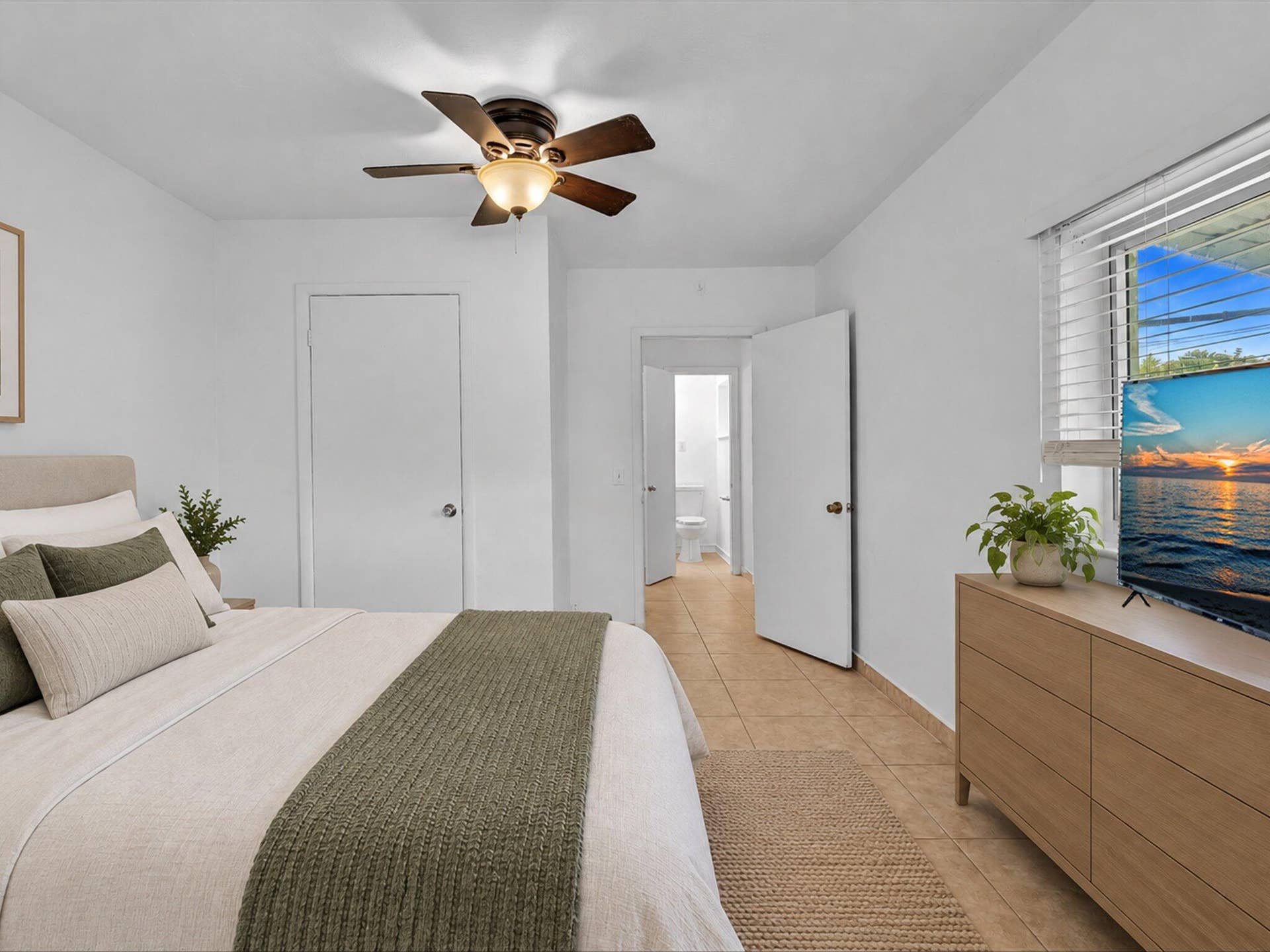 132 SE 2ND Court, Dania Beach, Dania Beach, FL 33004 Ceramic tile flooring, ceiling fan with integrated lighting, and horizontal window blinds