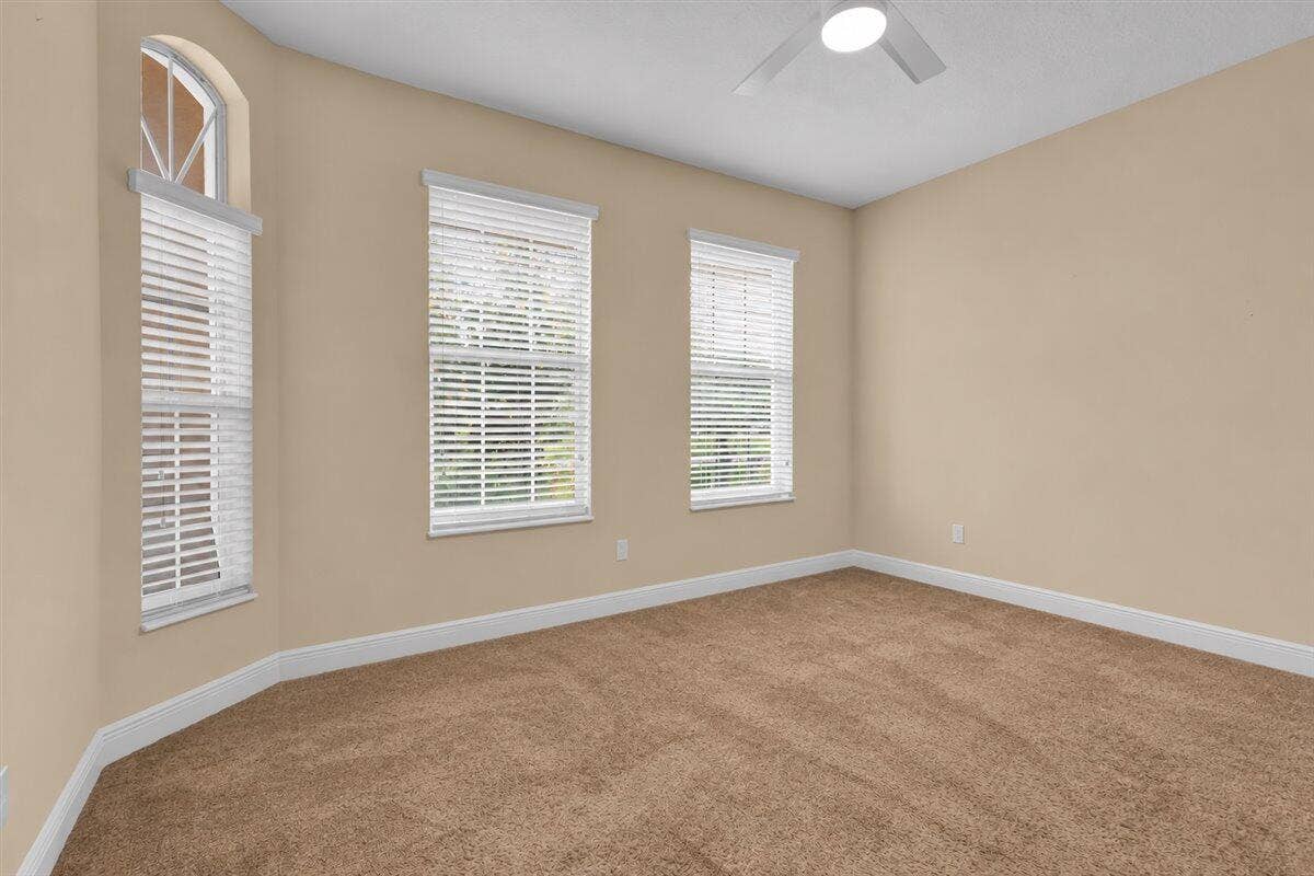 Empty Beige Room with Arched Windows