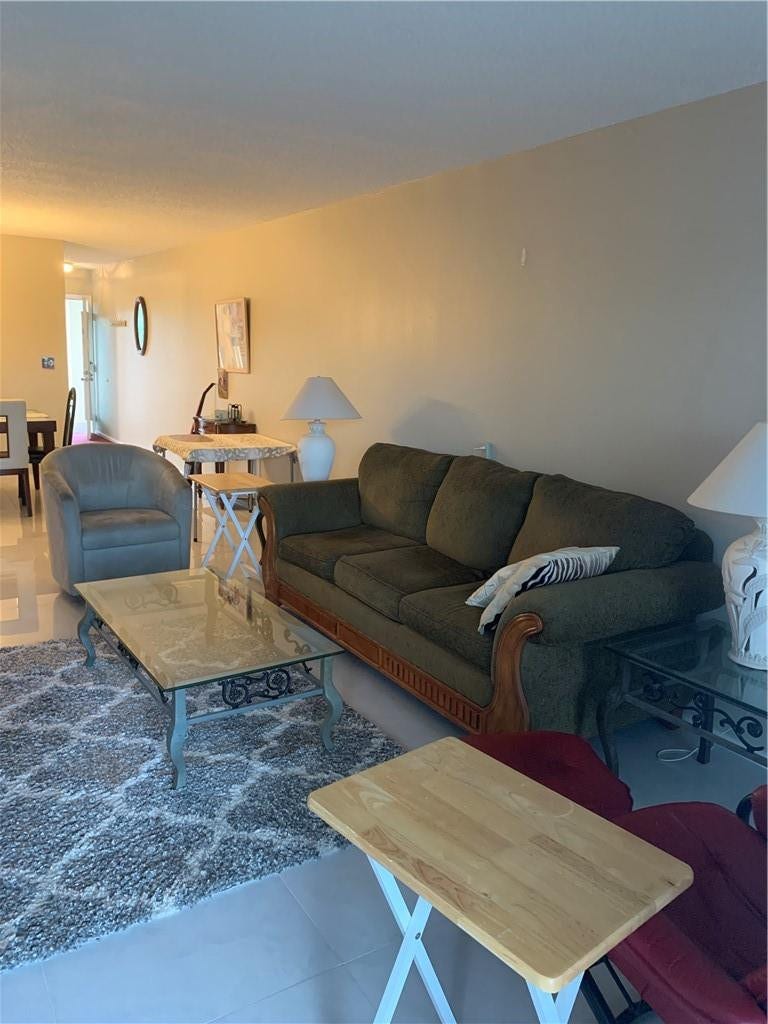 2305 LUCAYA Lane, #L4, Coconut Creek, Coconut Creek, FL 33066 Open living area featuring large-format tile flooring and neutral wall tones