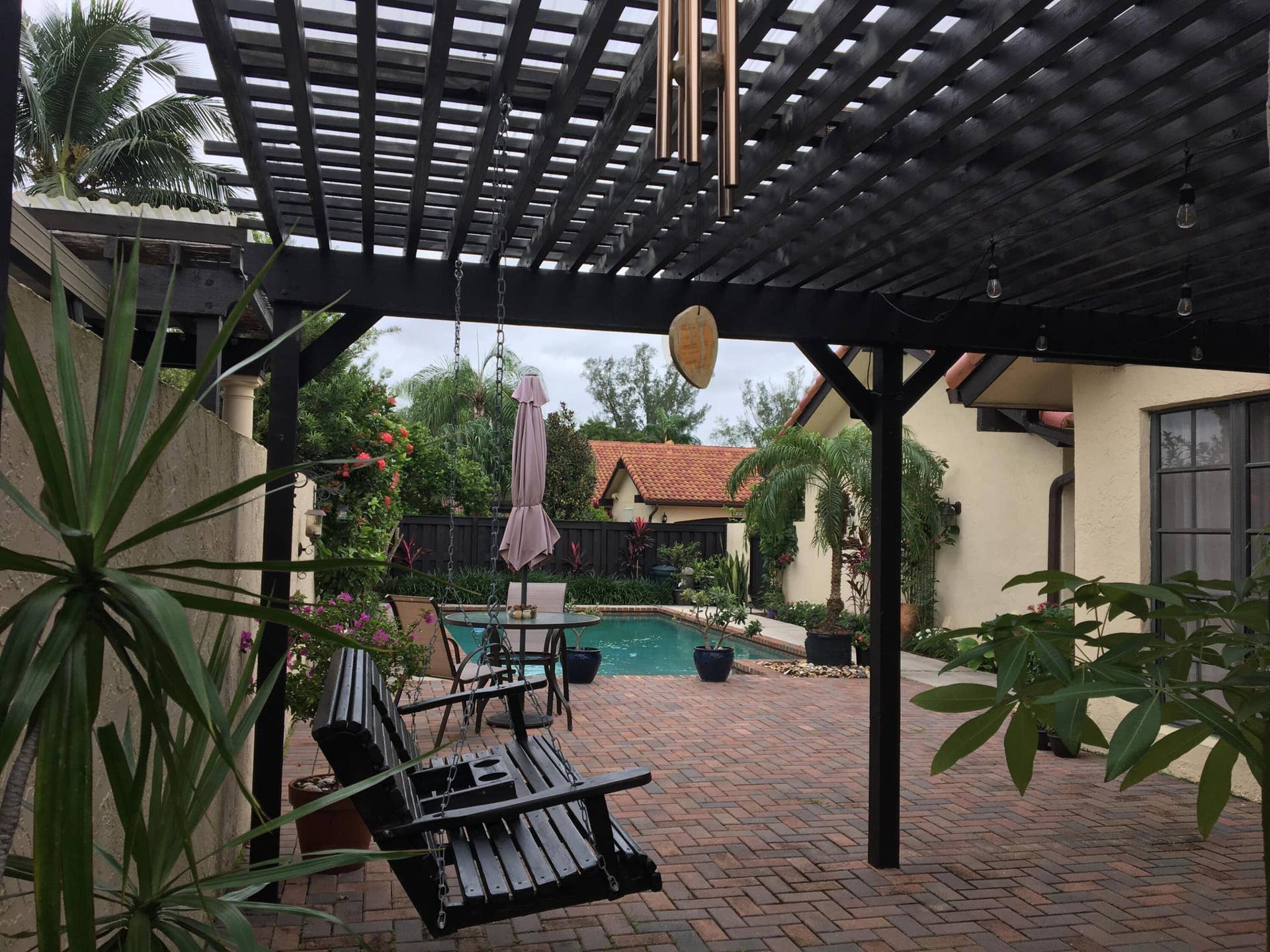 Roof-covered pergola
