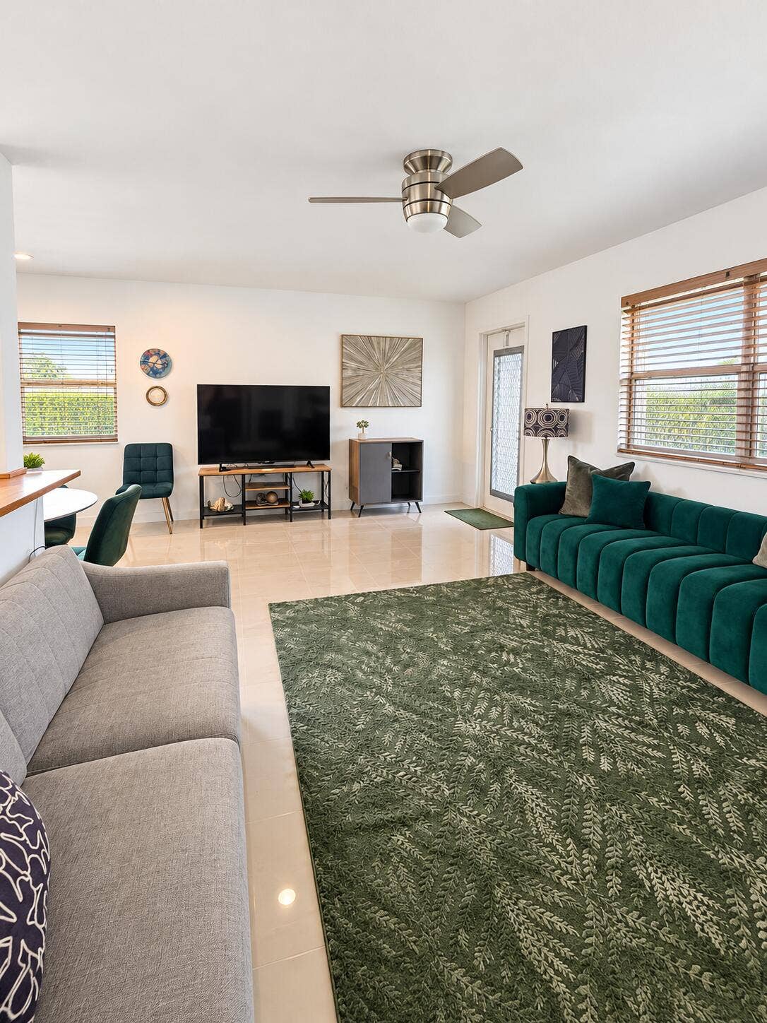 686 BRITTANY O, Delray Beach, FL 33446 Neutral tile flooring, ceiling fan with light fixture, and multiple windows featuring horizontal blinds