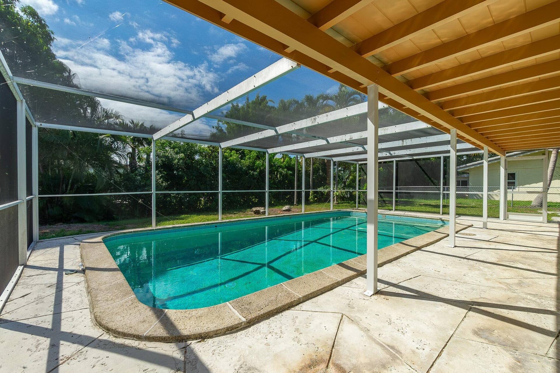 Enclosed pool at rear of home