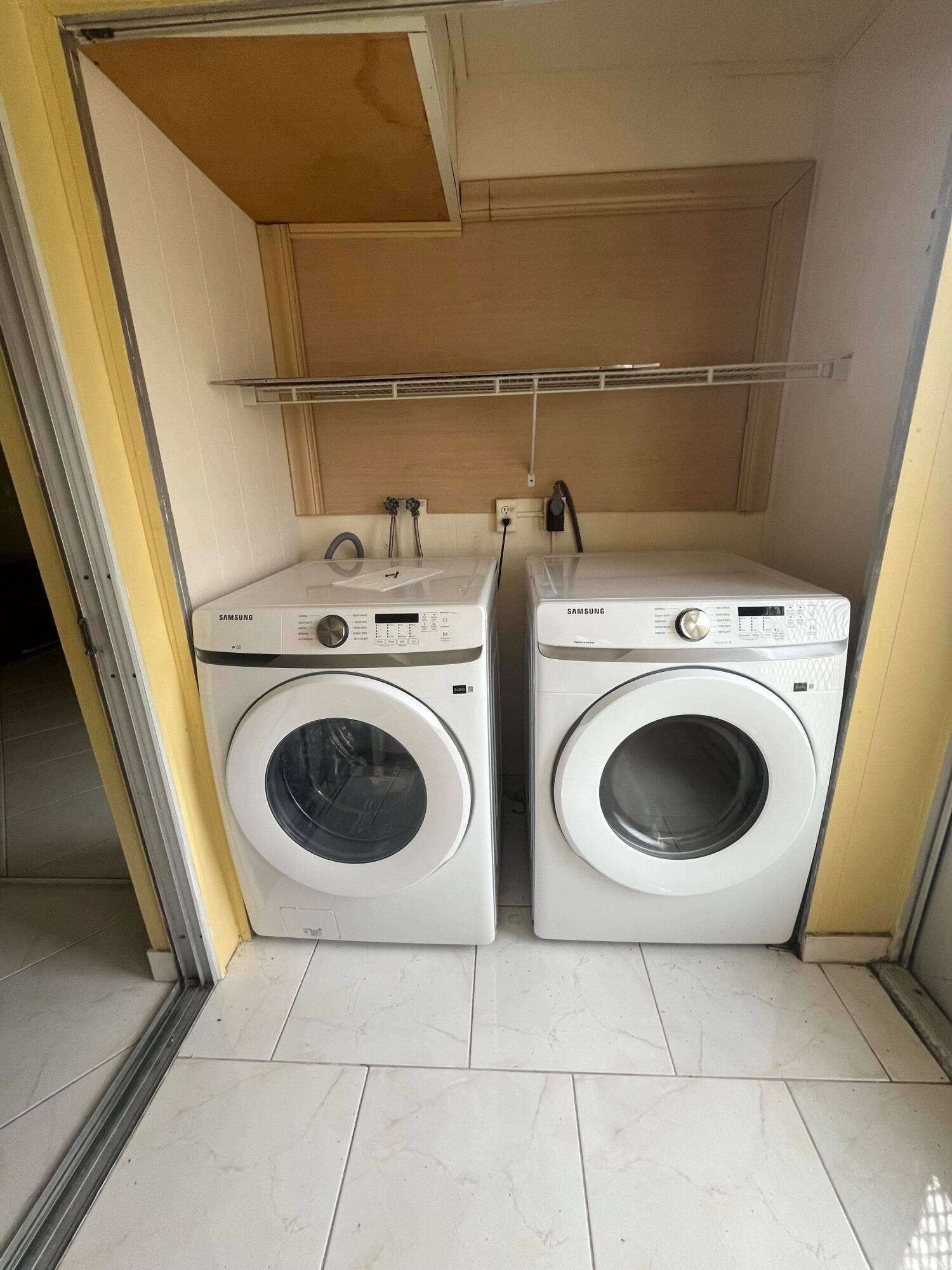 278 SEVILLE L, Delray Beach, FL 33446 full sized side by side washer/dryer on the patio utility closet.