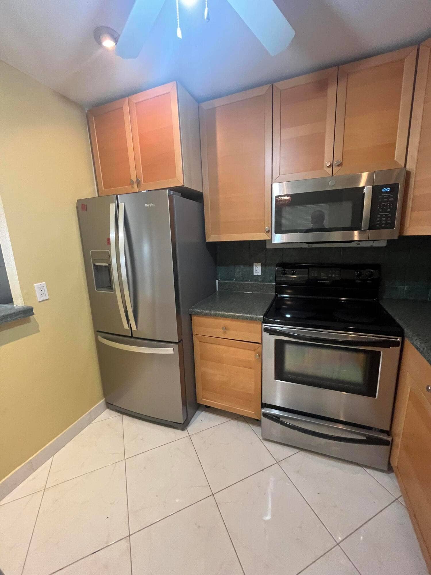 278 SEVILLE L, Delray Beach, FL 33446 updated kitchen with stainless steel appliances and wood cabinetry