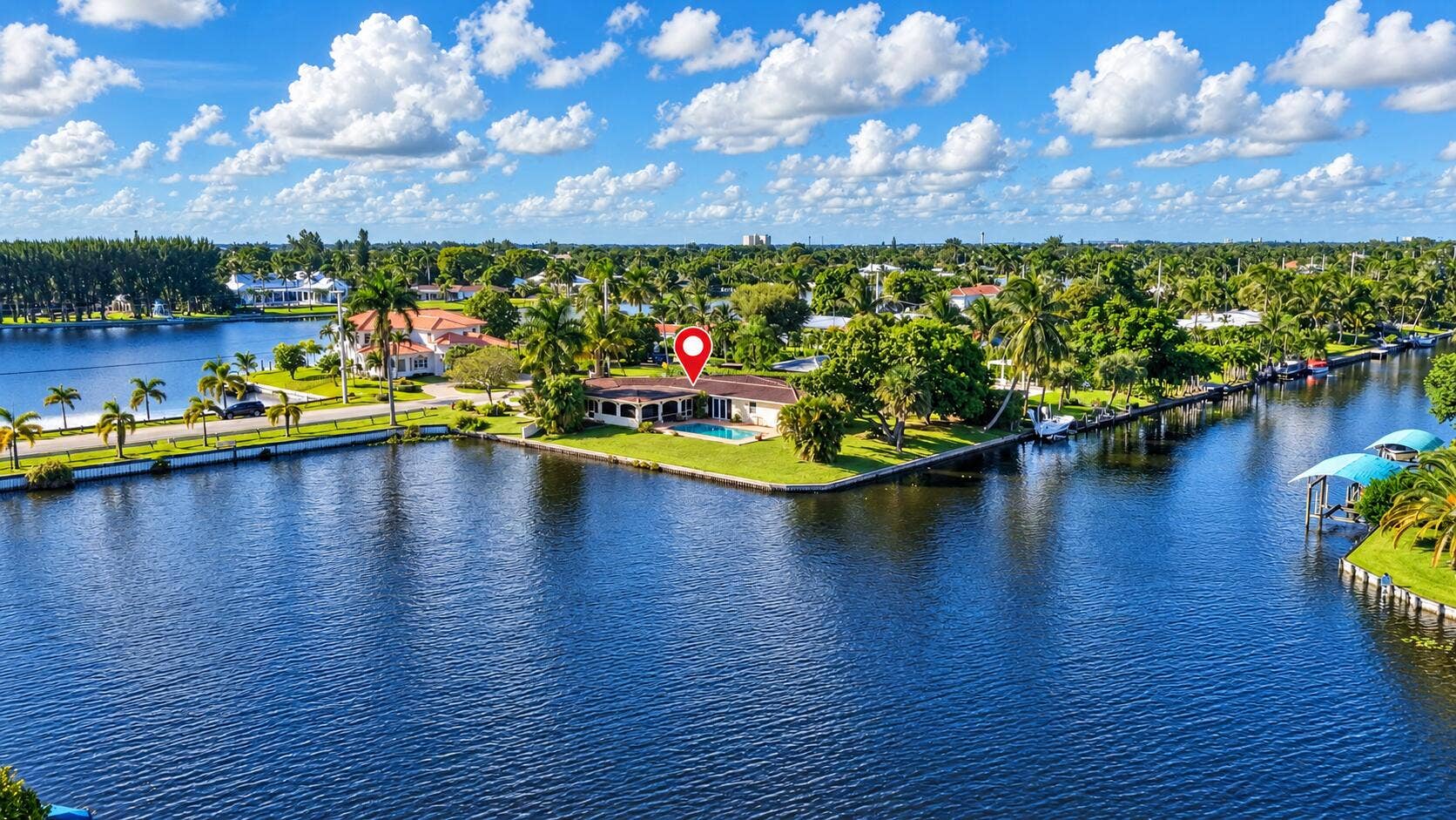 7438 Pine Tree Lane, West Palm Beach, FL 33406 Waterfront Home w Pool