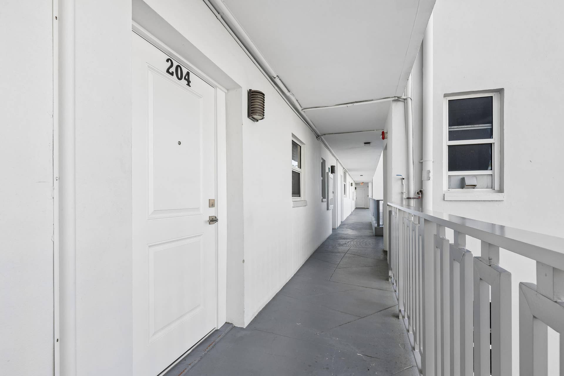 711 N Birch Road, #204, Fort Lauderdale, FL 33304 Where you see the small window...that is a common laundry room, extra storage room, and elevator is close by.