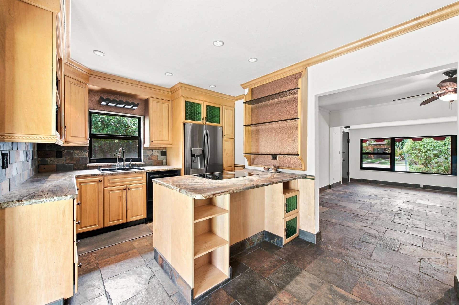 1110 SW 18TH Court, Fort Lauderdale, FL 33315 Kitchen featuring natural finish cabinetry, stone-surface countertops, stone tile flooring, built-in open shelving, and recessed lighting
