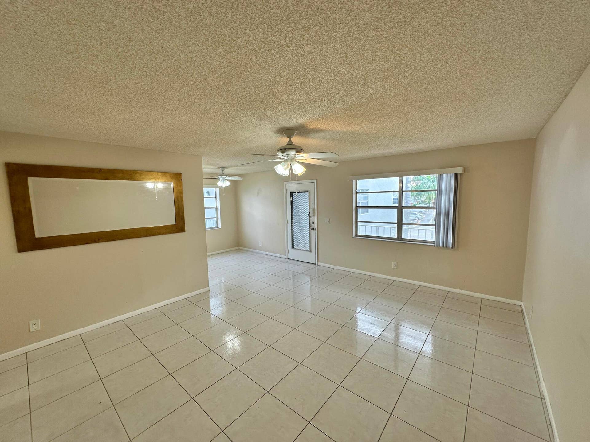Spacious Living and Dining Area with Kitchen to the Left