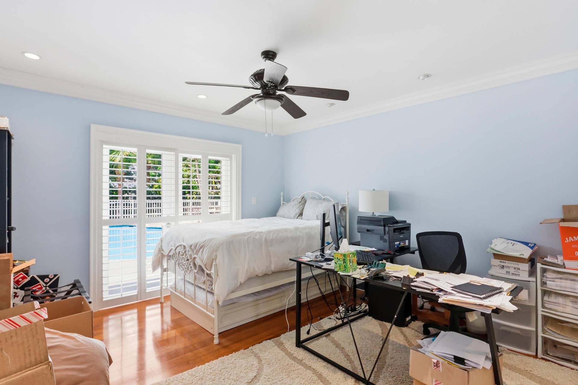 2919 Banyan Blvd Circle NW, Boca Raton, FL 33431 Bedroom featuring wood-finish flooring, crown molding, recessed lighting, a ceiling fan, and sliding glass doors with plantation shutters