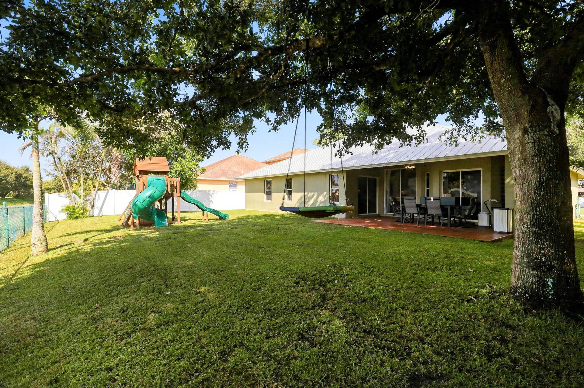 2326 SW WEBSTER Lane, Port St Lucie, FL 34953 backyard, playground included in sale