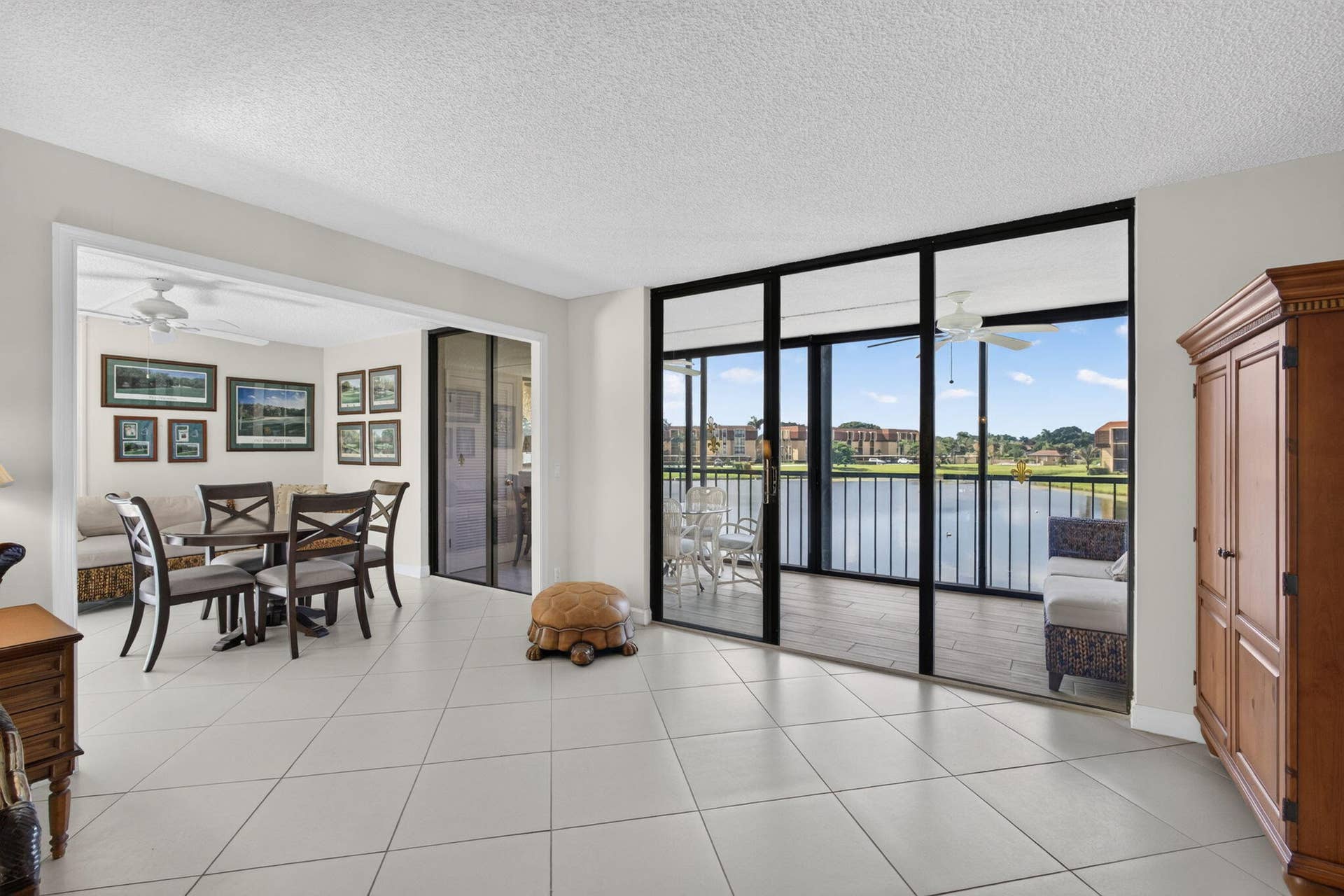 5344 WOODLAND LAKES Drive, #225, Palm Beach Gardens, FL 33418 Living Room to Balcony & Game Room