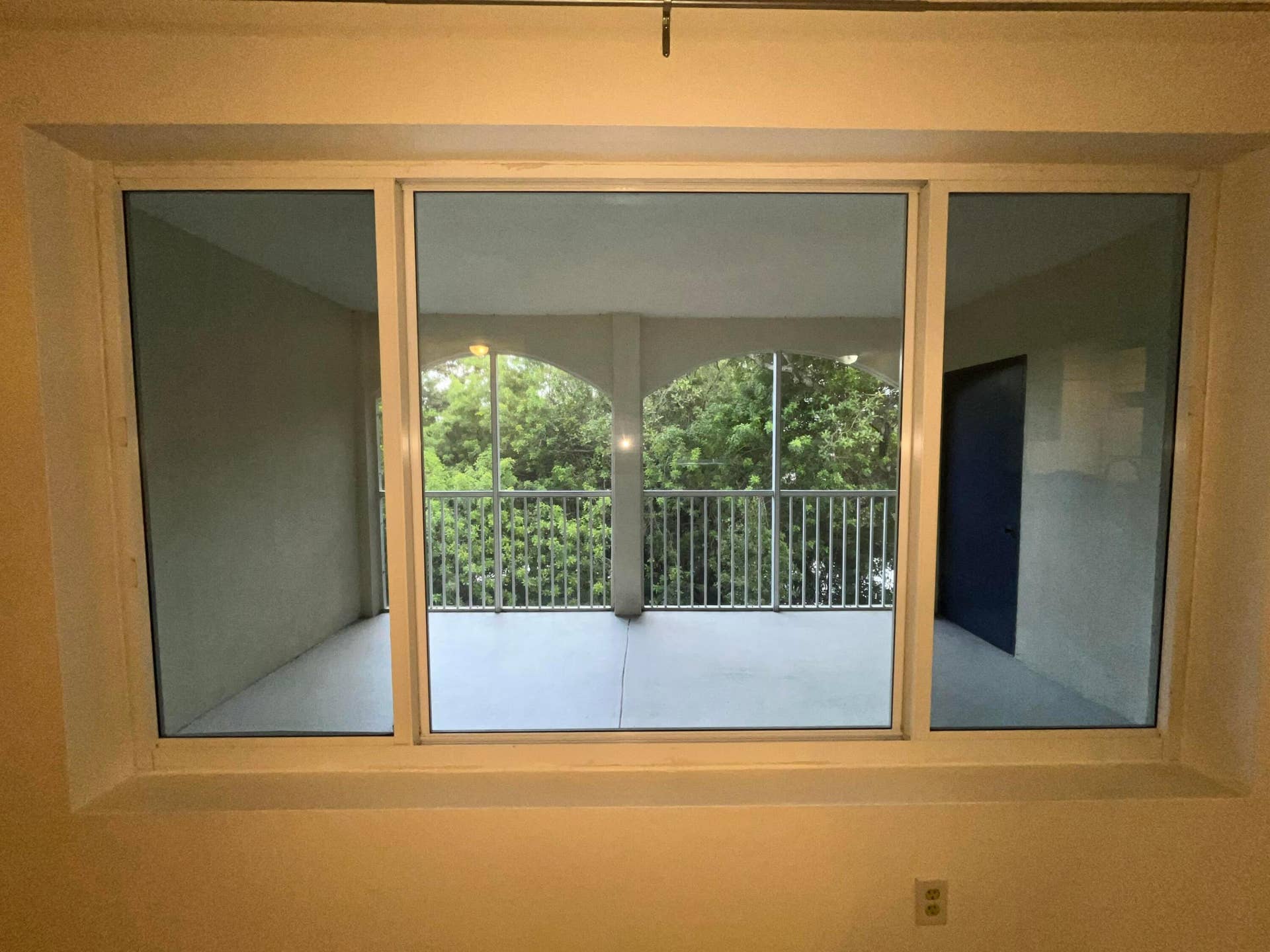 Picture window with view of patio