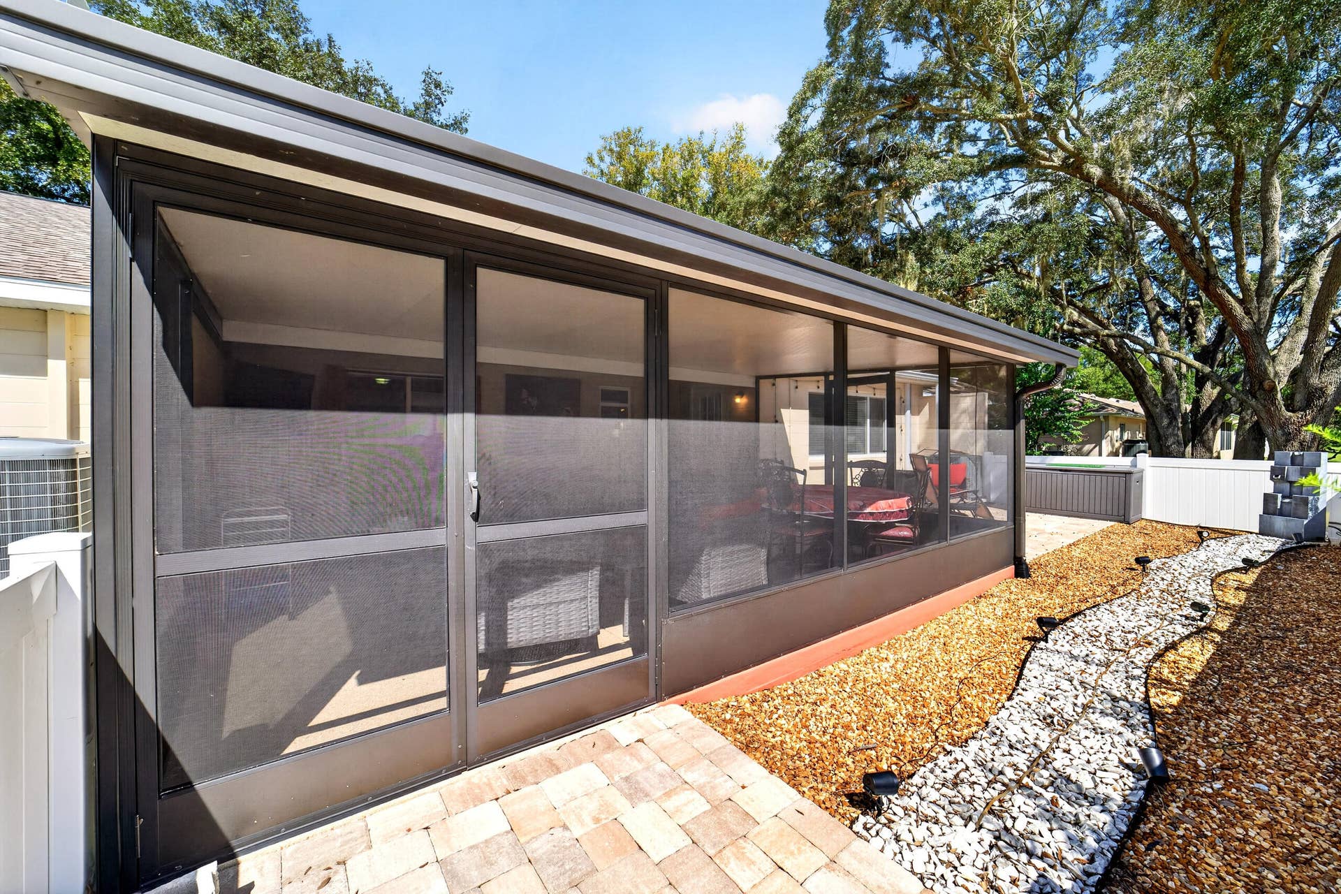 9675 SW 85th Avenue, #B, Ocala, FL 34481 Patio with Pavers and Rocks out Back