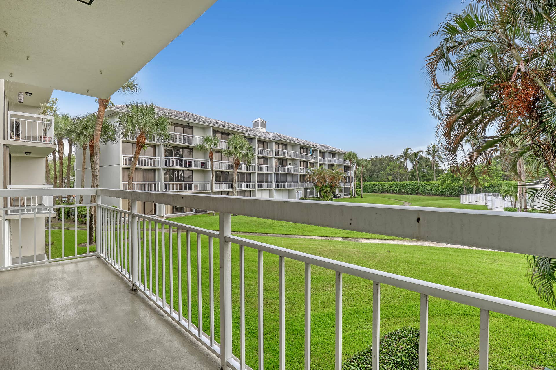 2621 VILLAGE Boulevard, #203, West Palm Beach, FL 33409 Balcony looking over pool