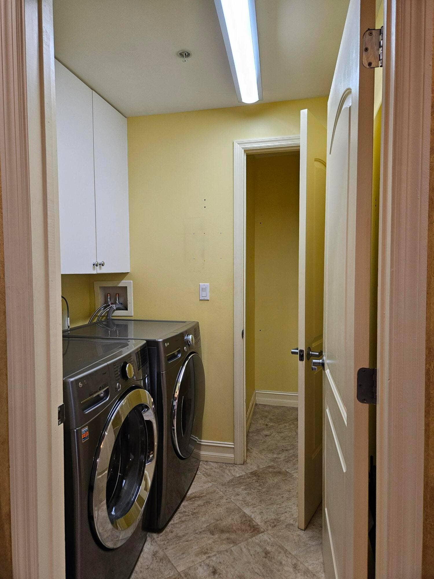 large closet inside laundry room
