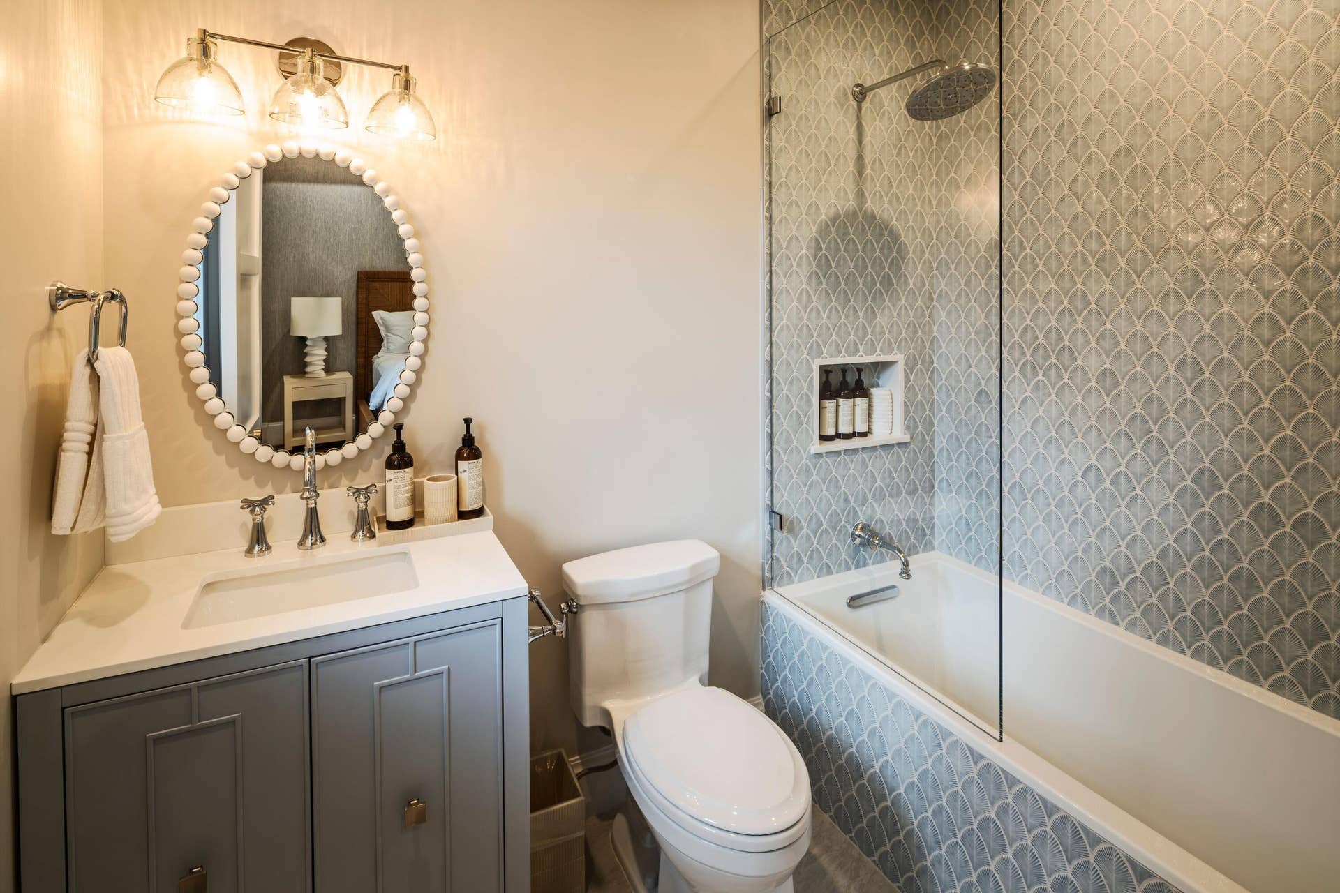 309 Greymon Drive, West Palm Beach, FL 33405 39 - Bathroom with gray vanity, oval mir